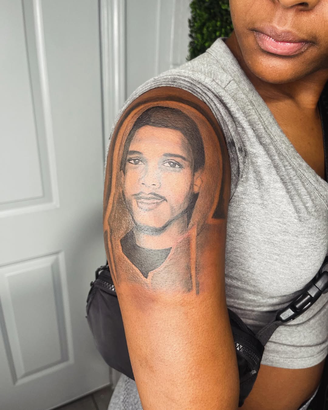Portrait of a man realism tattoo on the upper arm by Uncle Fade Tattoo Artist ✍🏾