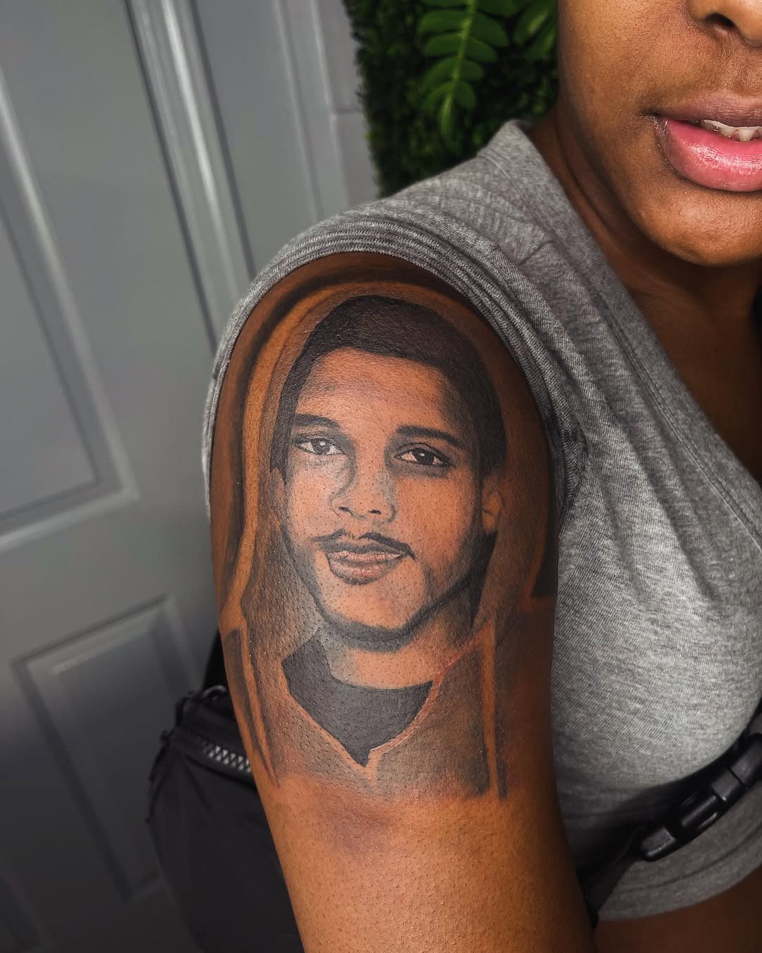 Portrait of a man realism tattoo on the upper arm by Uncle Fade Tattoo Artist ✍🏾