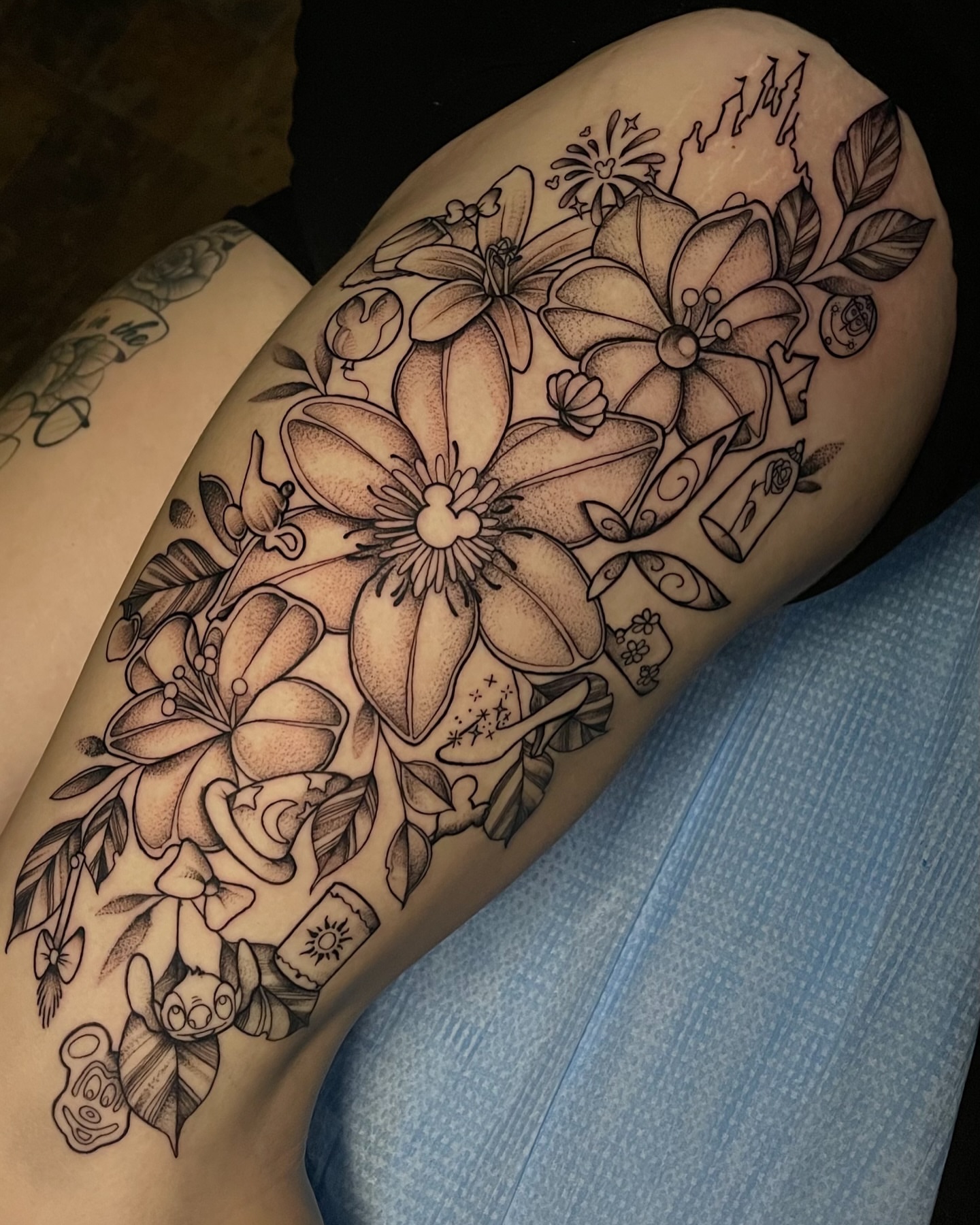 Floral bouquet realism tattoo on the thigh by Brittany Welsh, Marlton, New Jersey