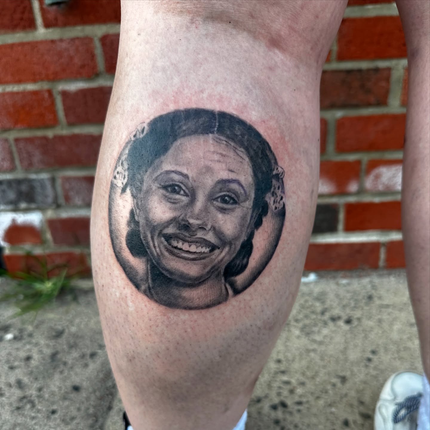 Portrait realism tattoo on the forearm by Mia Layne 🤎