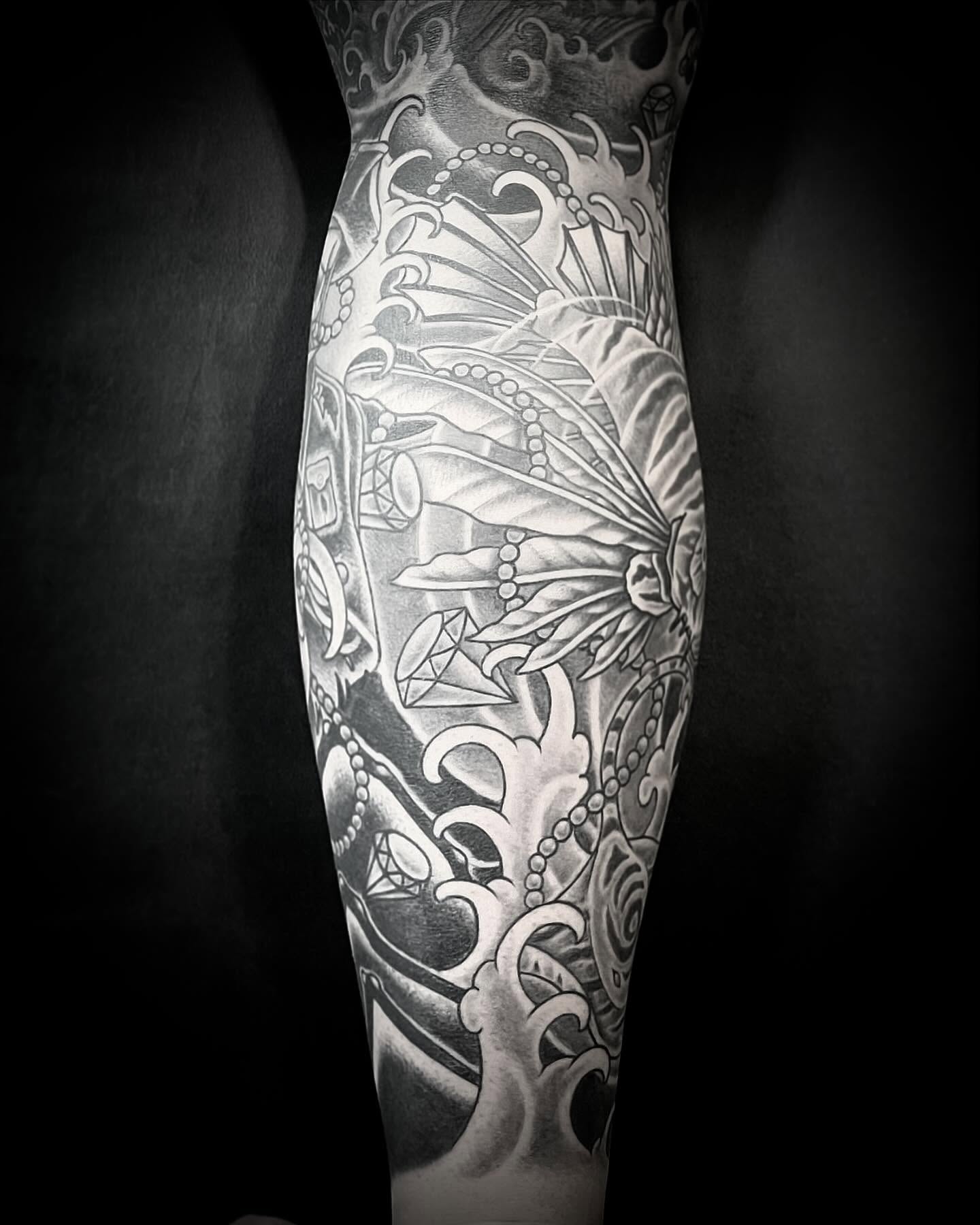 Butterfly and floral geometric tattoo on the forearm by Jacob Finelli