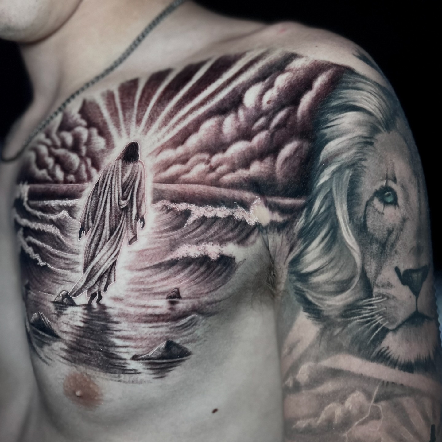 Religious figure walking through water realism tattoo on the chest by Bradi