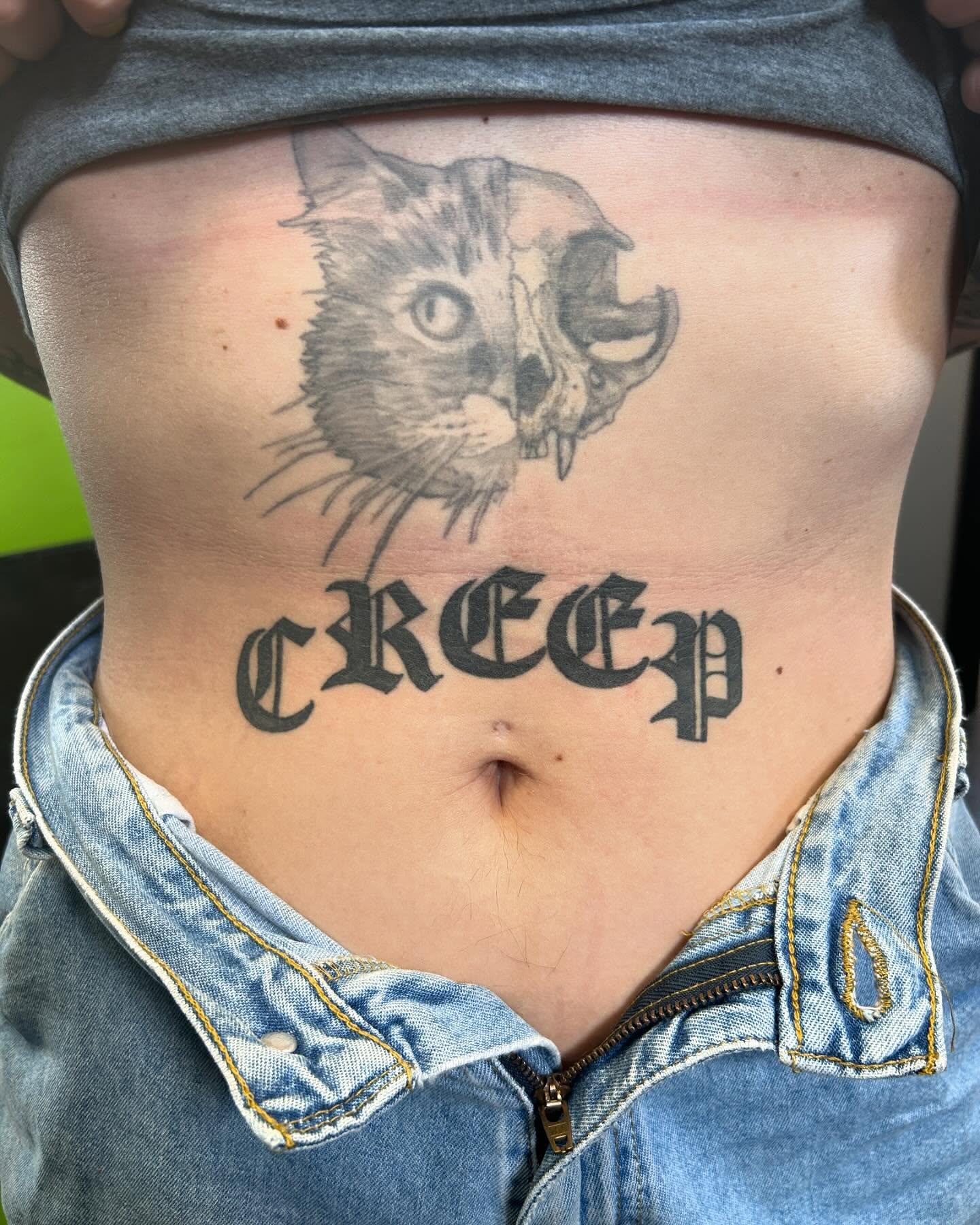 Cat and skull realism tattoo on the ribs by B Hendrix, Cuyahoga Falls, Ohio