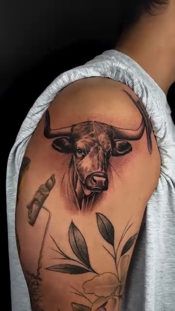 Bull head realism tattoo by Carlos Lujan