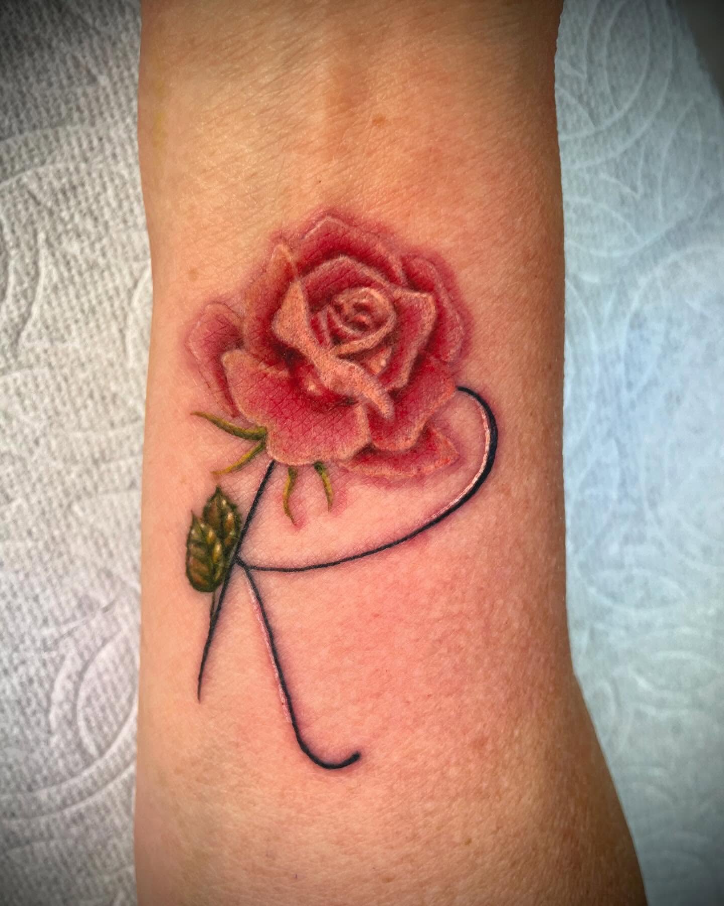 Rose realism tattoo on the forearm by tattoos by lego