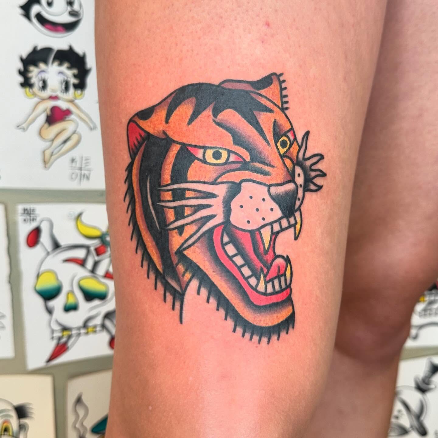 Tiger head American traditional tattoo on the forearm by Keon Ostby, Tempe, Arizona