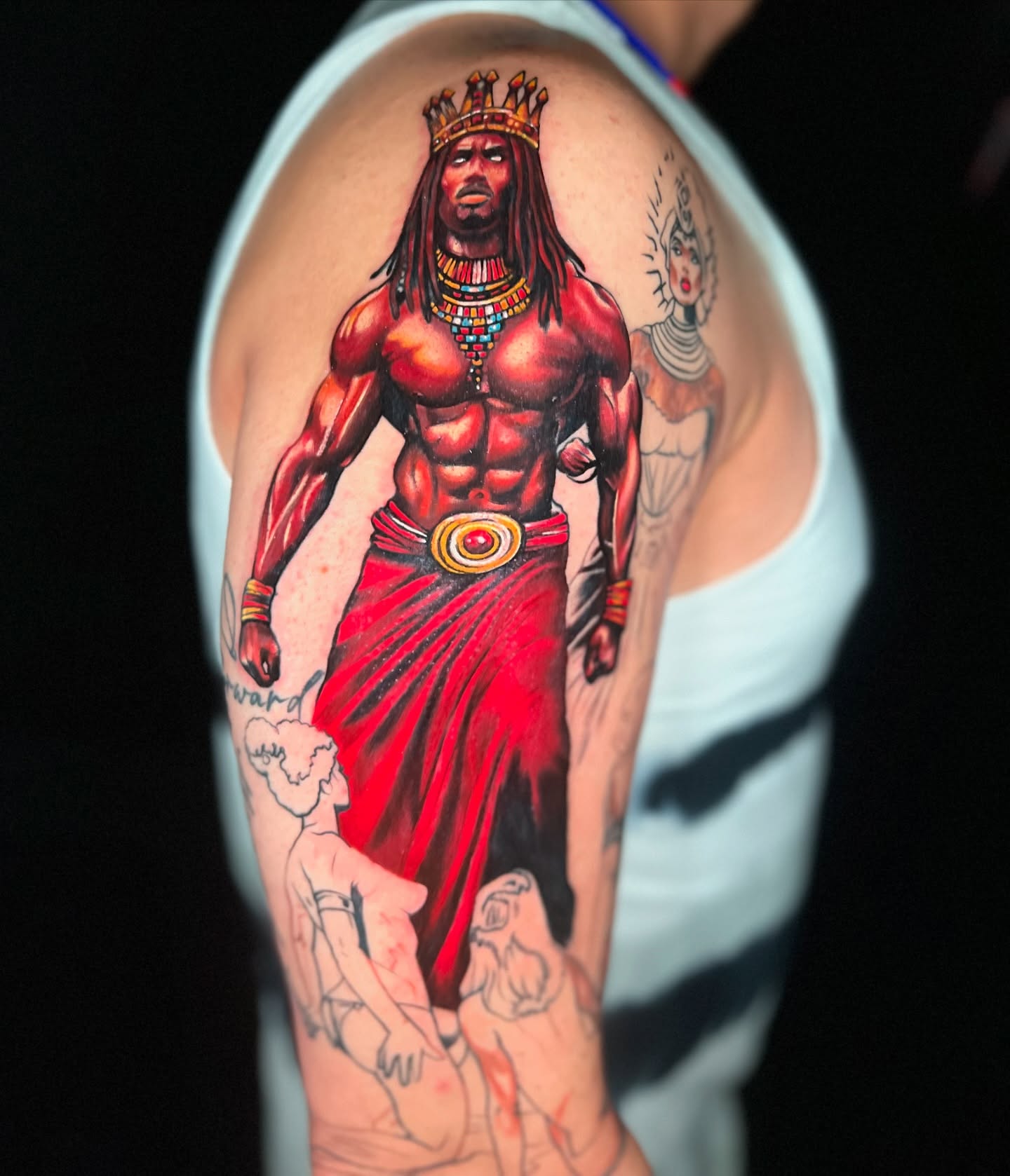 King realism tattoo on the upper arm by Yanko Reyes