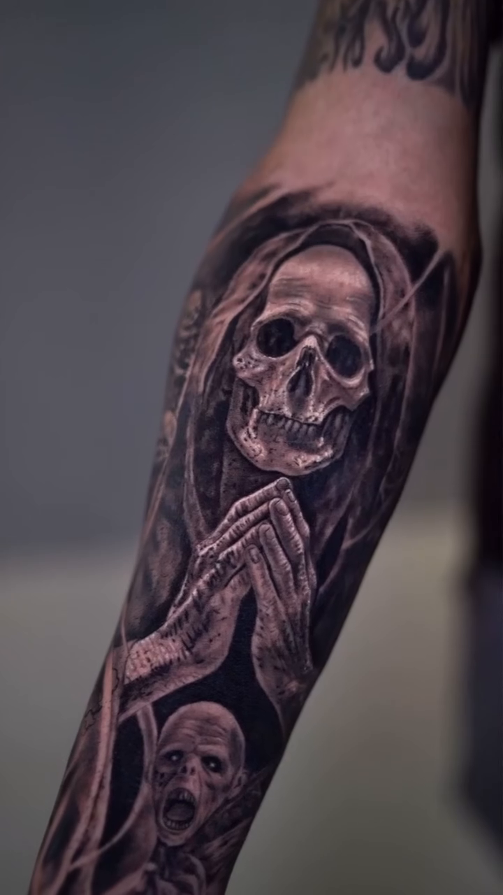 Grim Reaper with skulls dark realism tattoo by Yohandri Sosa