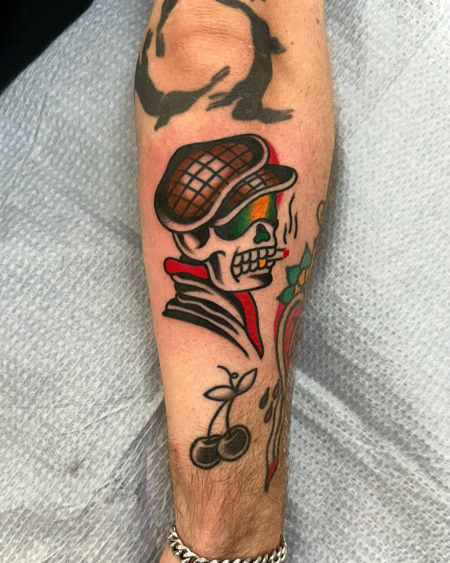 Skull wearing hat American traditional tattoo on the forearm by Nicholas Mella, Nashville, Tennessee