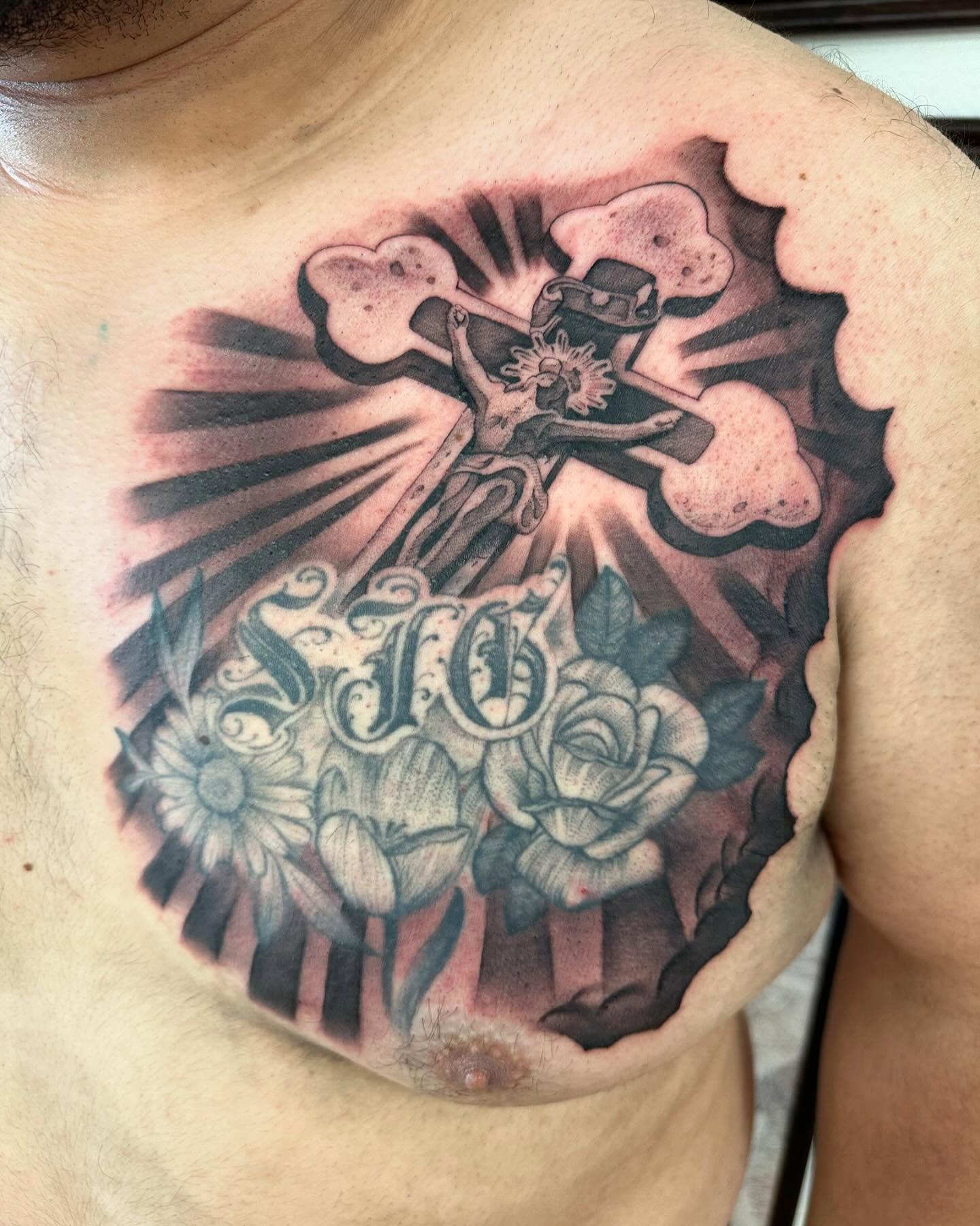 Cross and flowers black and grey tattoo on the chest by Juan Vega (tony)