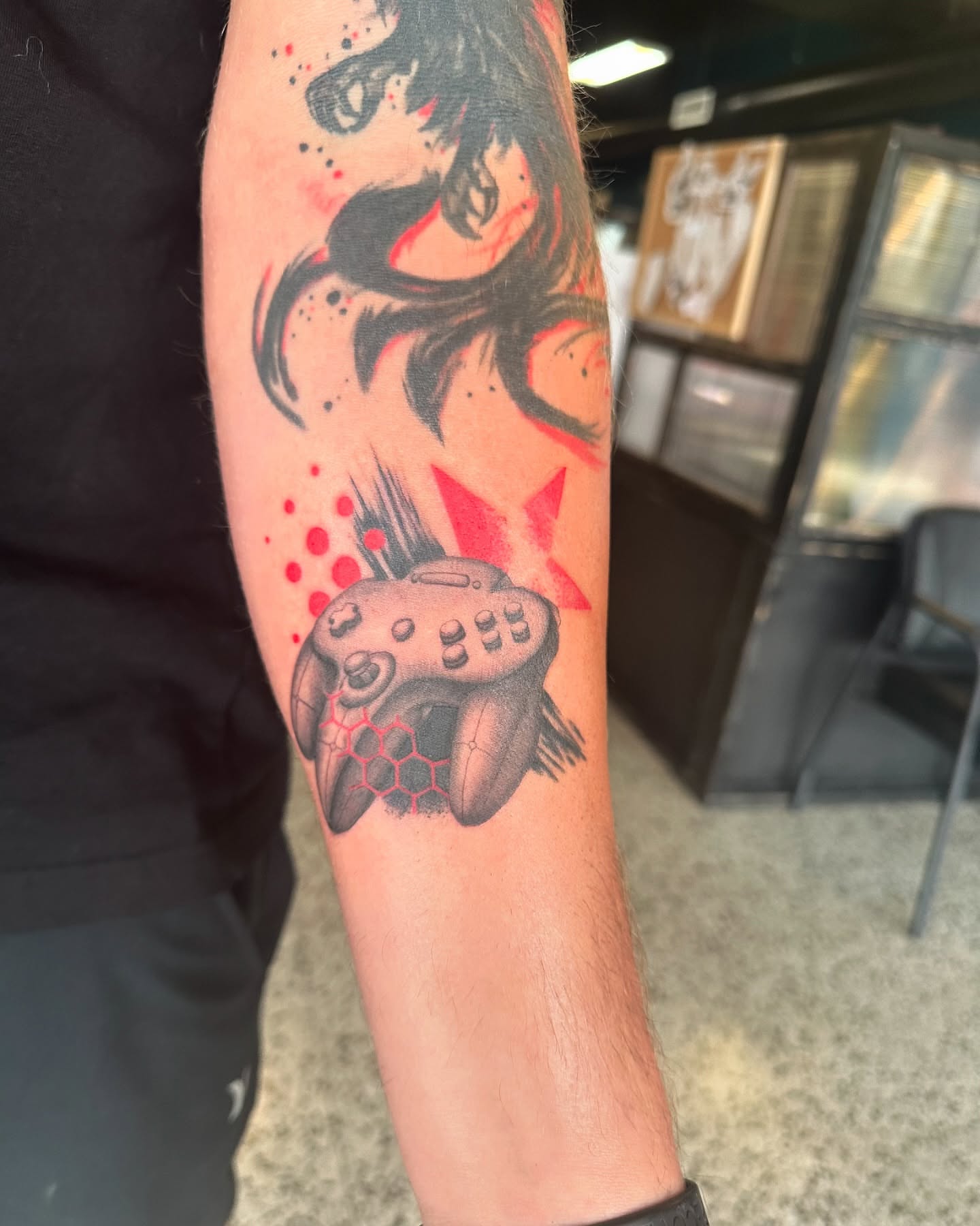 Video game controller dotwork tattoo on the forearm by (Joshua) Van Cummings