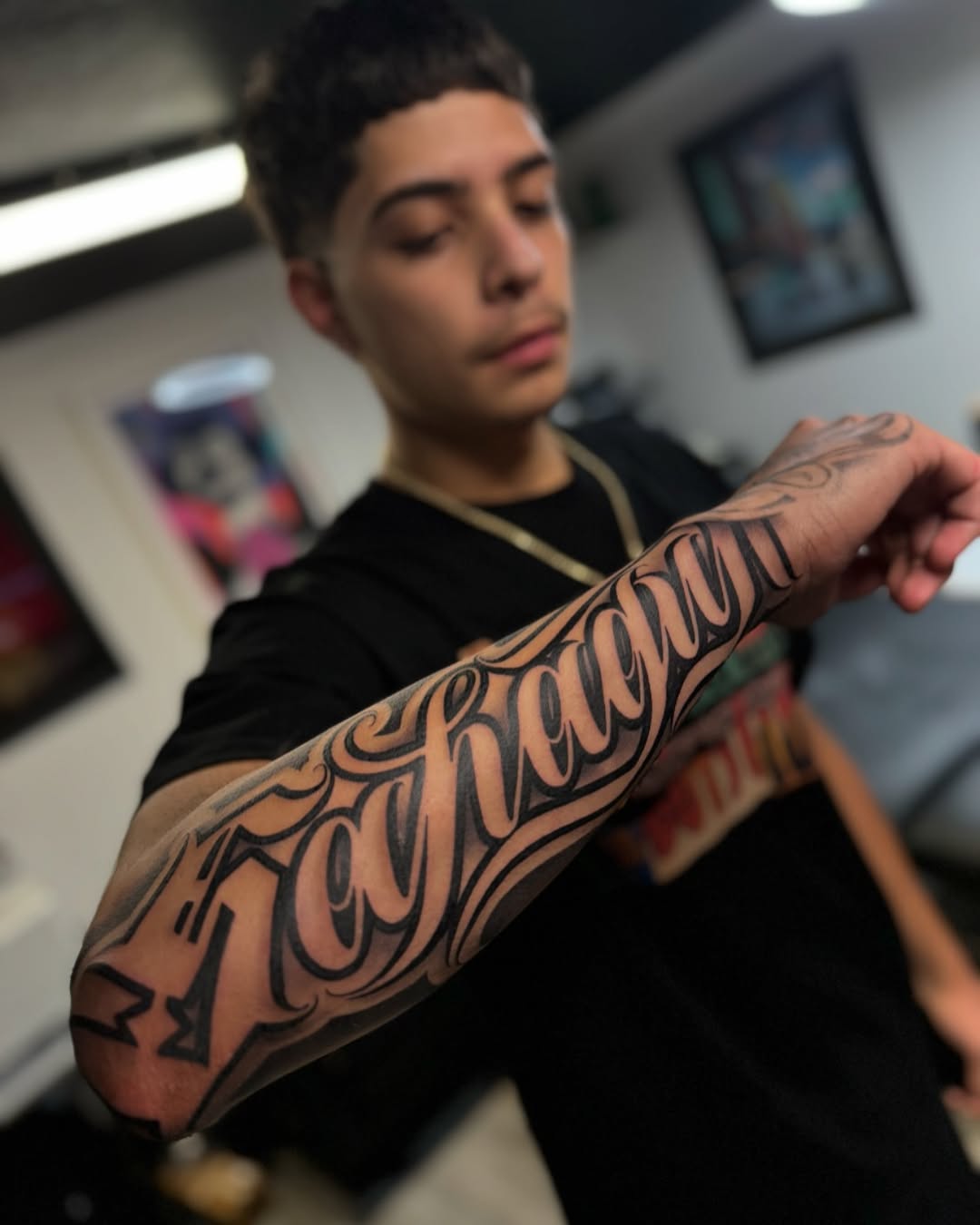 Tattoo by @rockyg_inkz — lettering_script, chicano