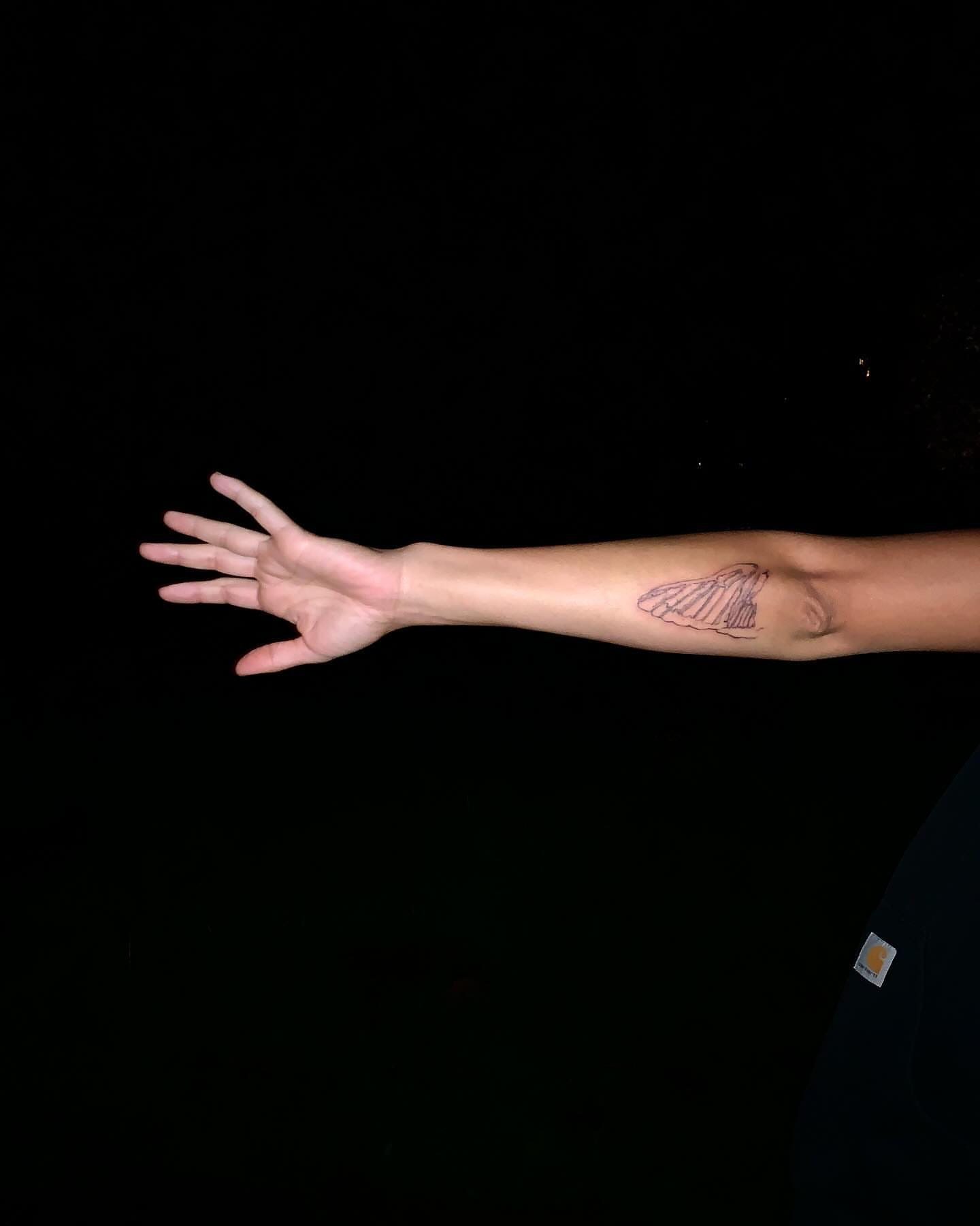 Shell black and grey tattoo on the forearm by 잡초
