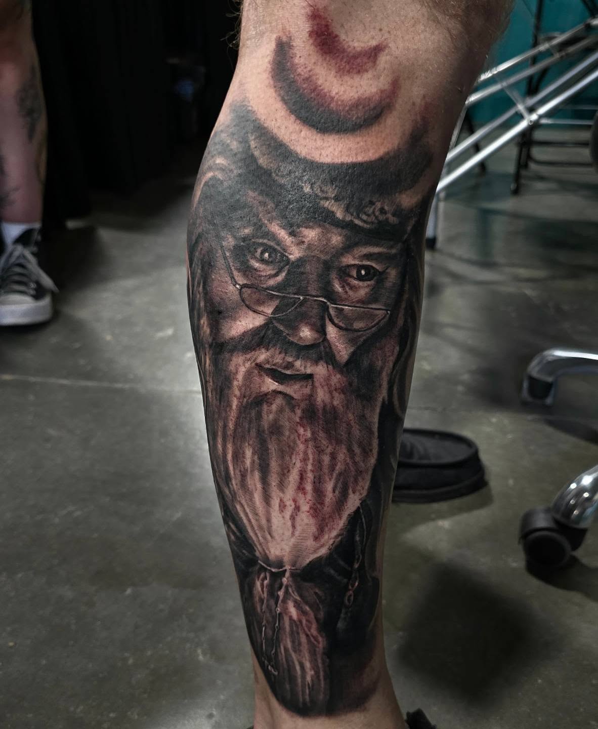 Bearded man realism tattoo on the forearm by Cody Lambert