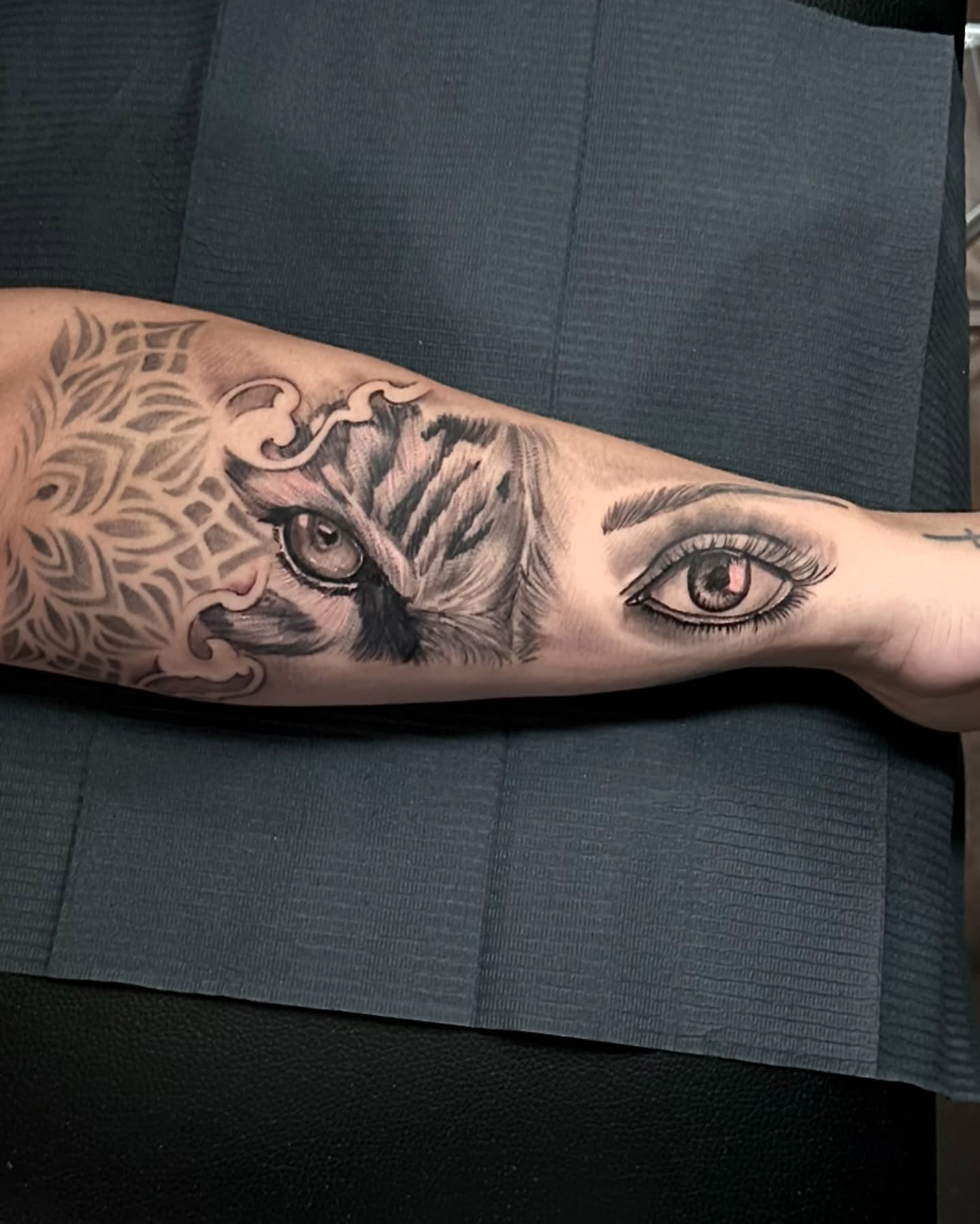 Eye and tiger realism tattoo on the forearm by Tattoo Artist