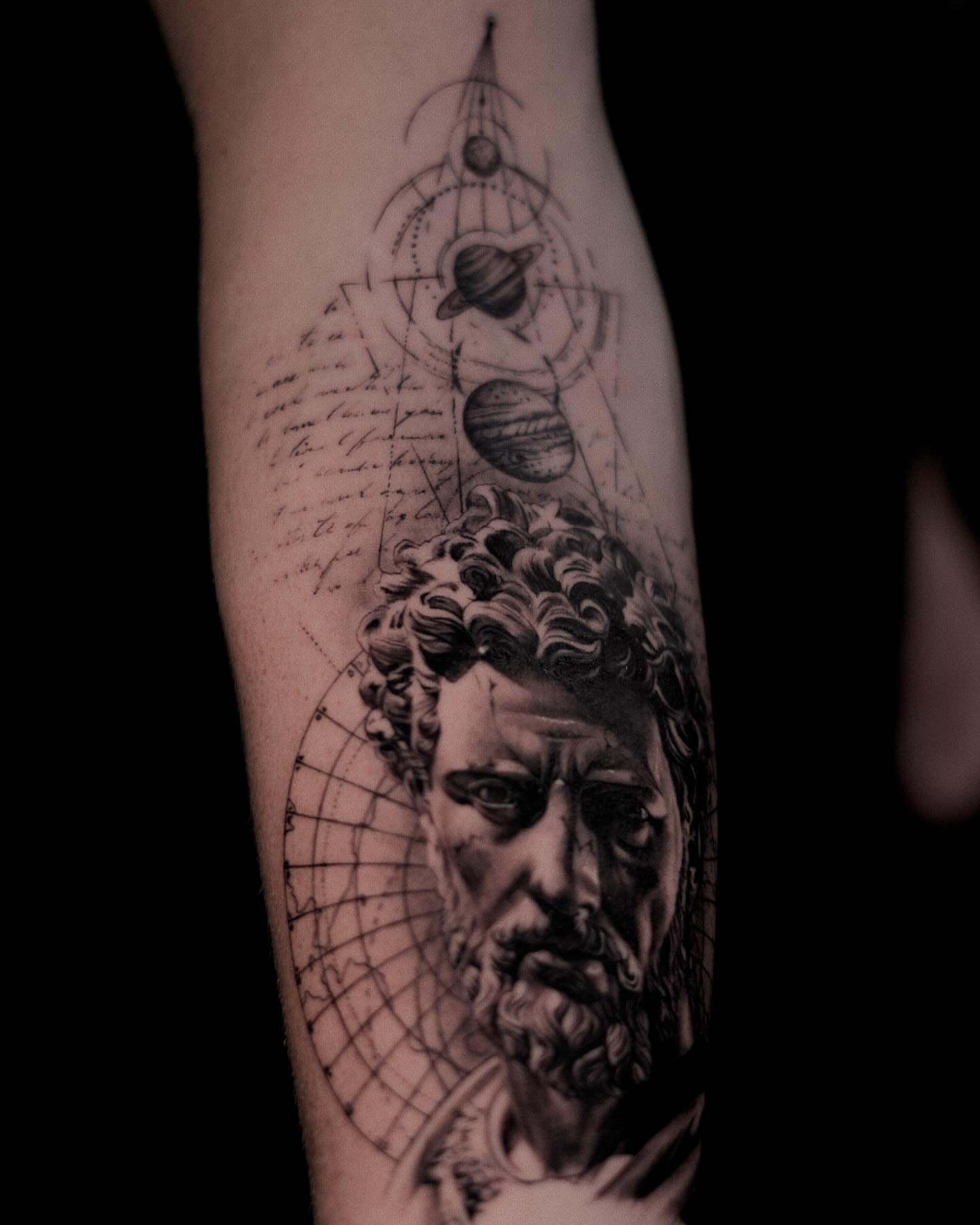 Astronomical portrait realism tattoo on the forearm by Ron Alvarez