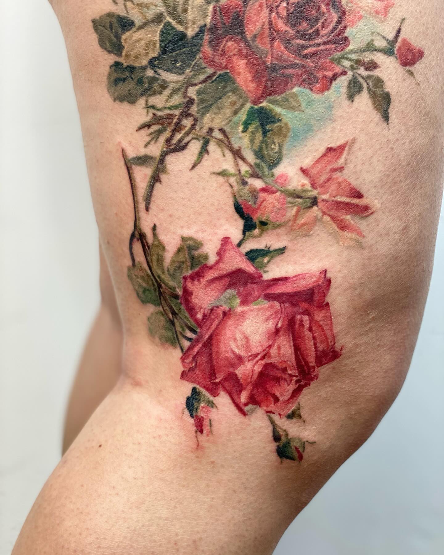 Roses realism tattoo on the forearm by Henry