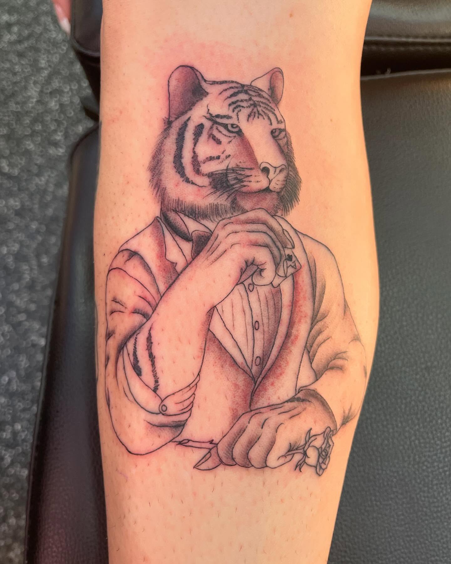 Tiger in suit realism tattoo on the forearm by tattoos by lego