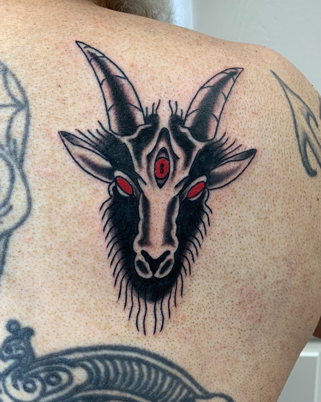 Goat head geometric tattoo on the shoulder by @goat76