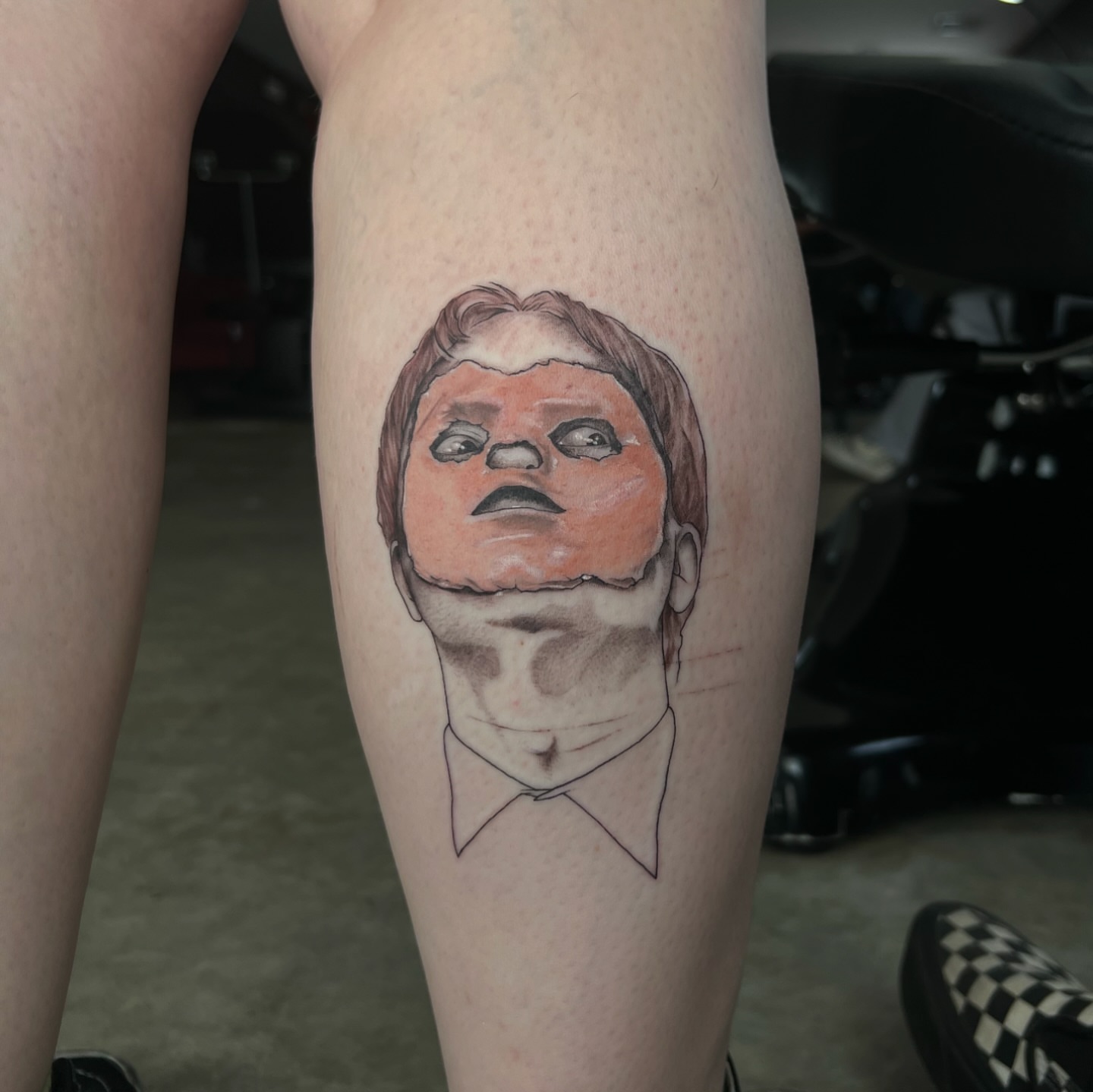 Man's face realism tattoo on the thigh by Dom