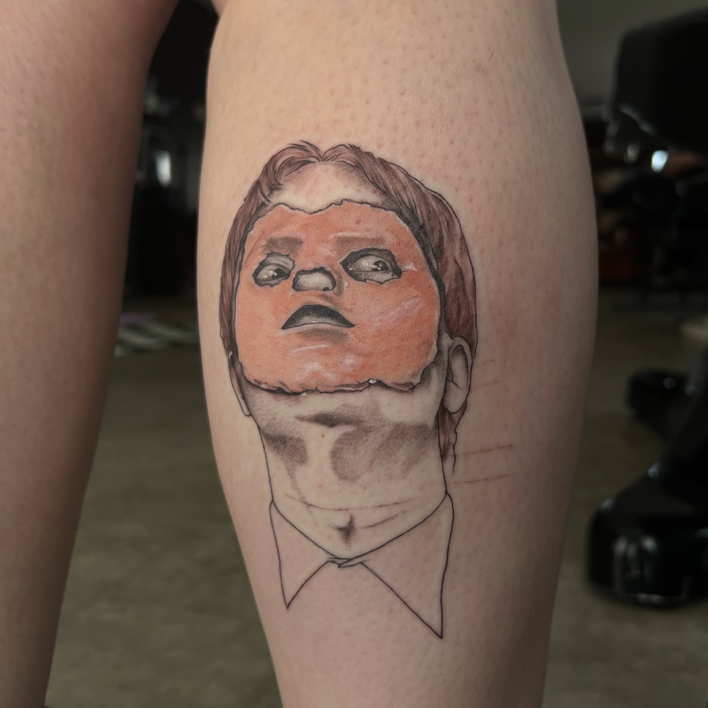 Man's head realism tattoo on the thigh by Dom
