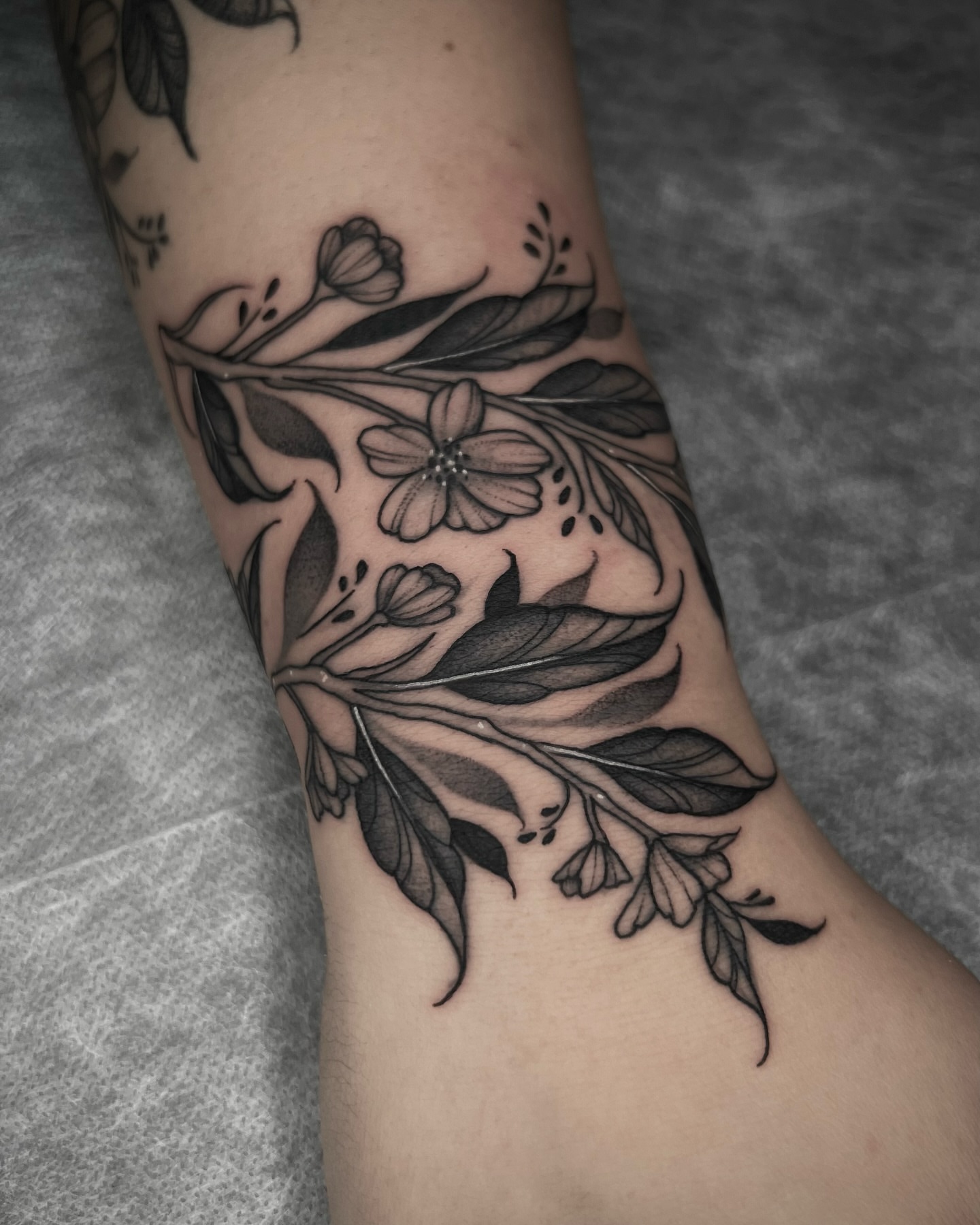 Flower and leaves black and grey tattoo on the forearm by ๐ฒ๐ฐ๐ธ๐๐ป๐๐ฝ โก