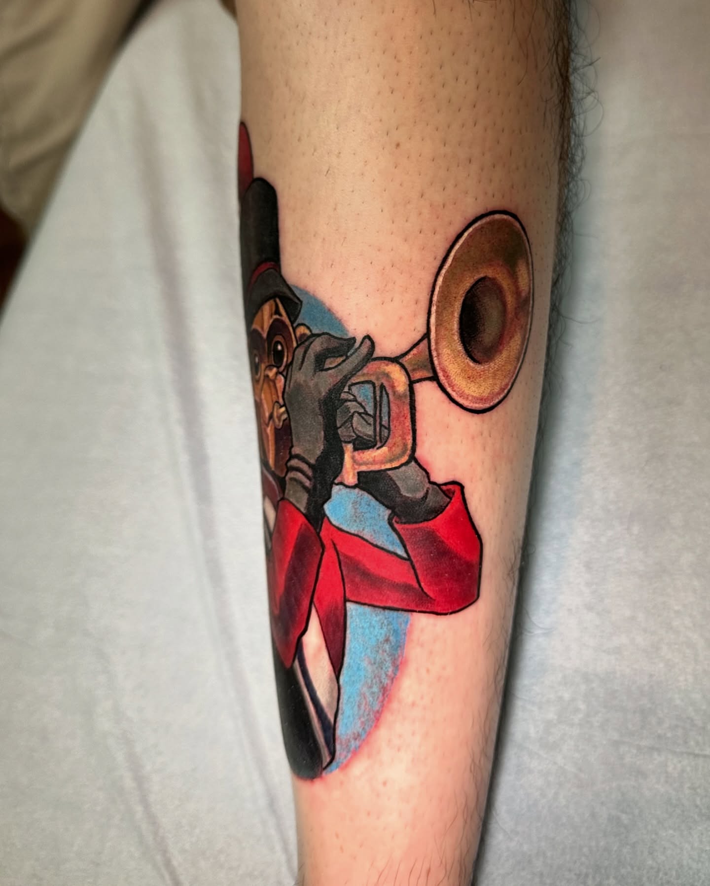 Jazz musician playing trumpet American traditional tattoo on the forearm by shane baker