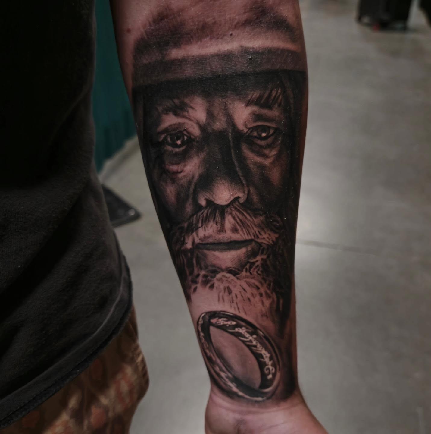 Old man realism tattoo on the forearm by Cody Lambert