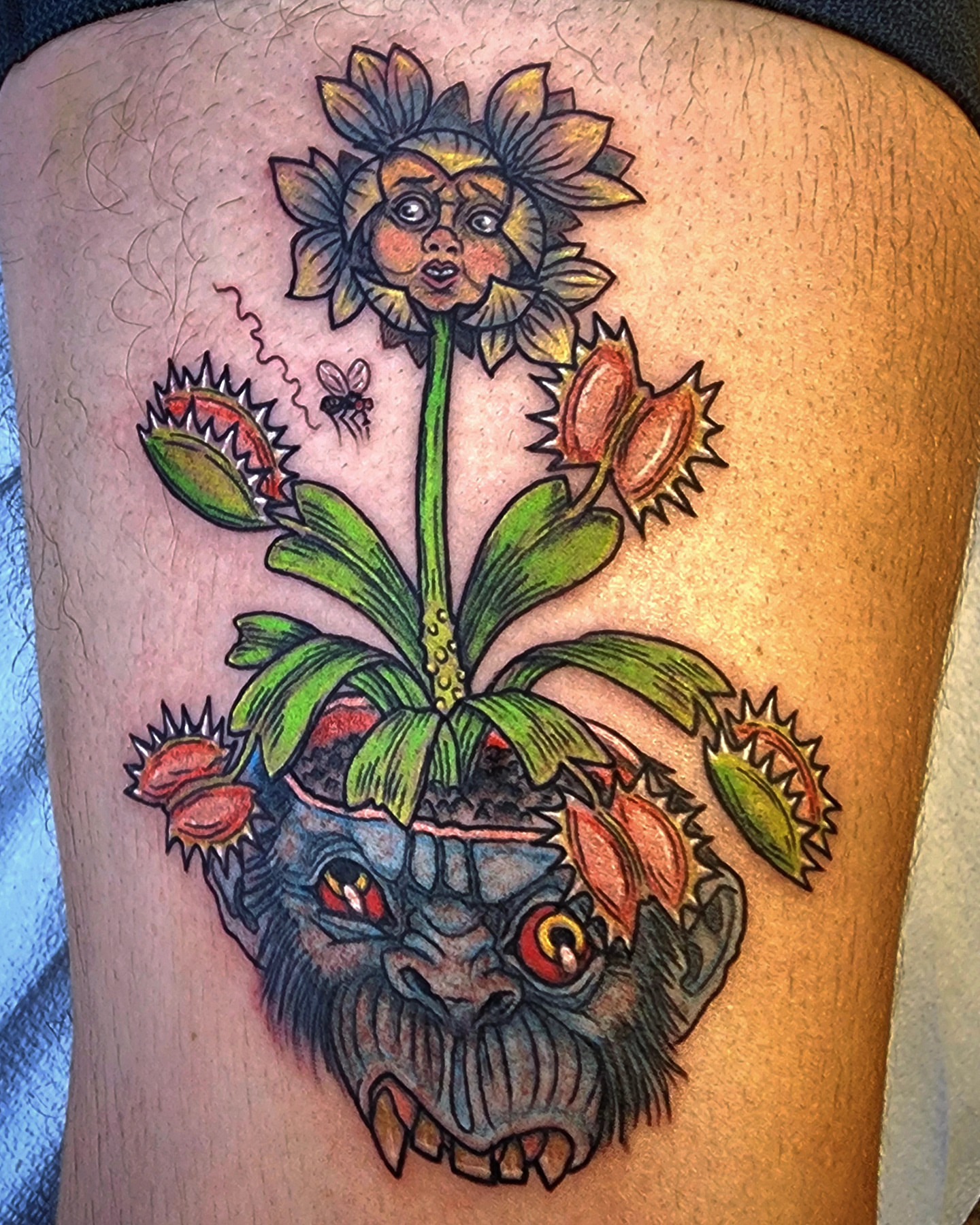 Demon plant American traditional tattoo on the thigh by Scott Fricke