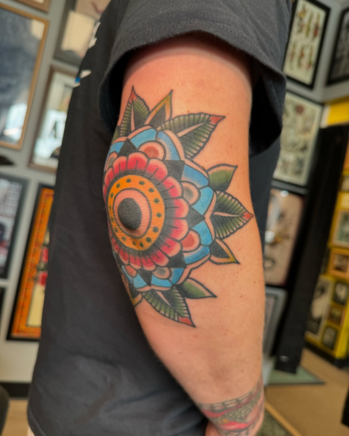 Floral design American traditional tattoo on the forearm by Jeremy Hudson