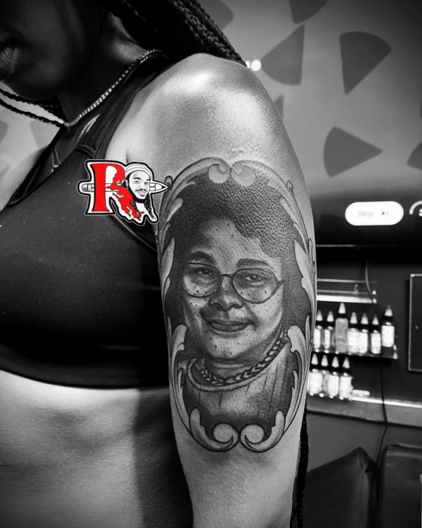 Portrait realism tattoo on the upper arm by Chicago Tattoo Artist