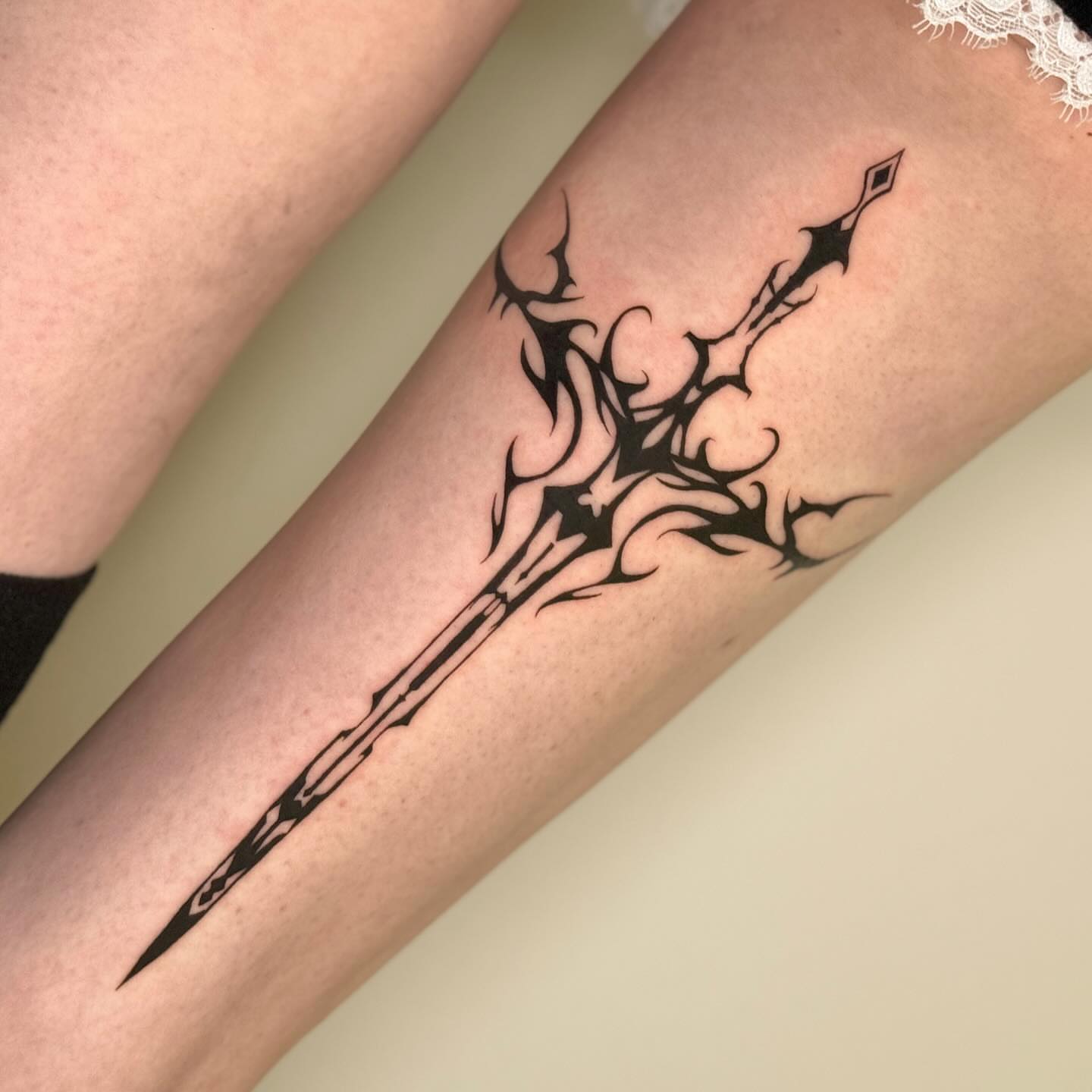 Sword tribal tattoo on the forearm by Mel