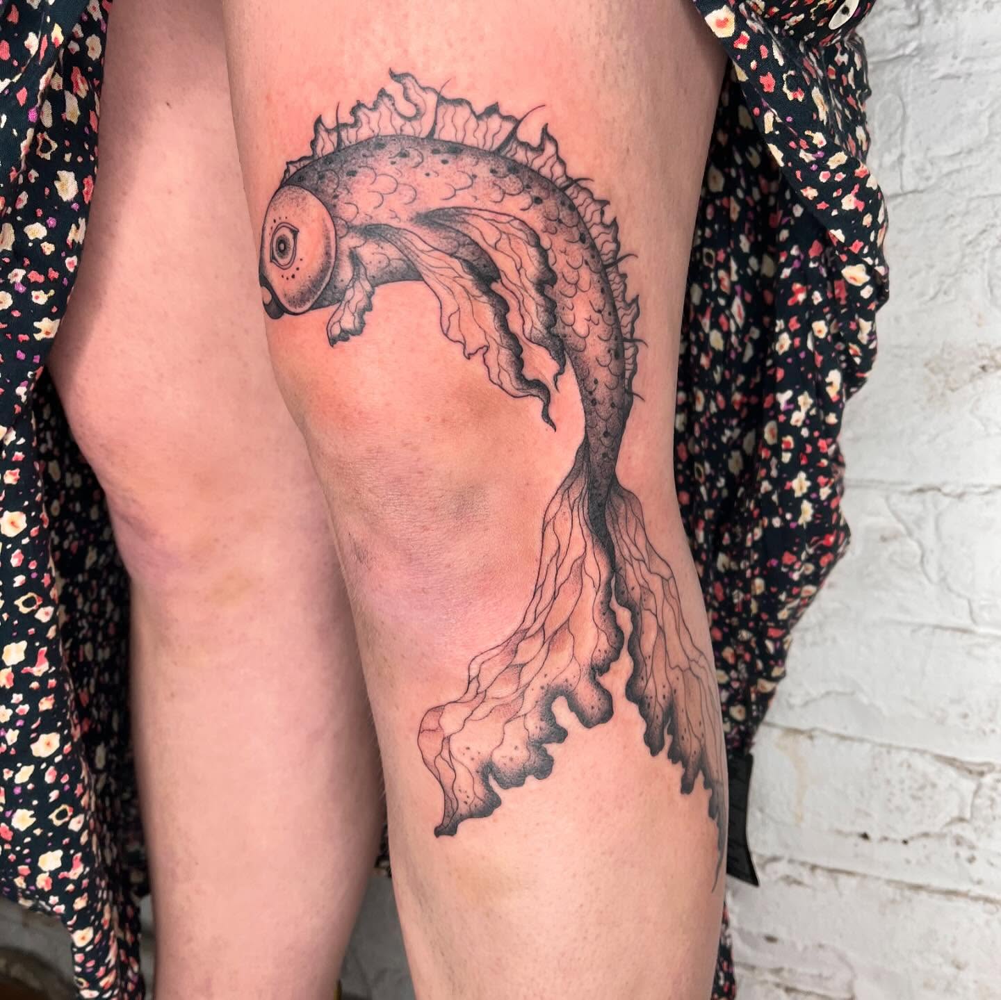 Fish black and grey tattoo on the leg by 𝔇𝔢𝔰𝔦