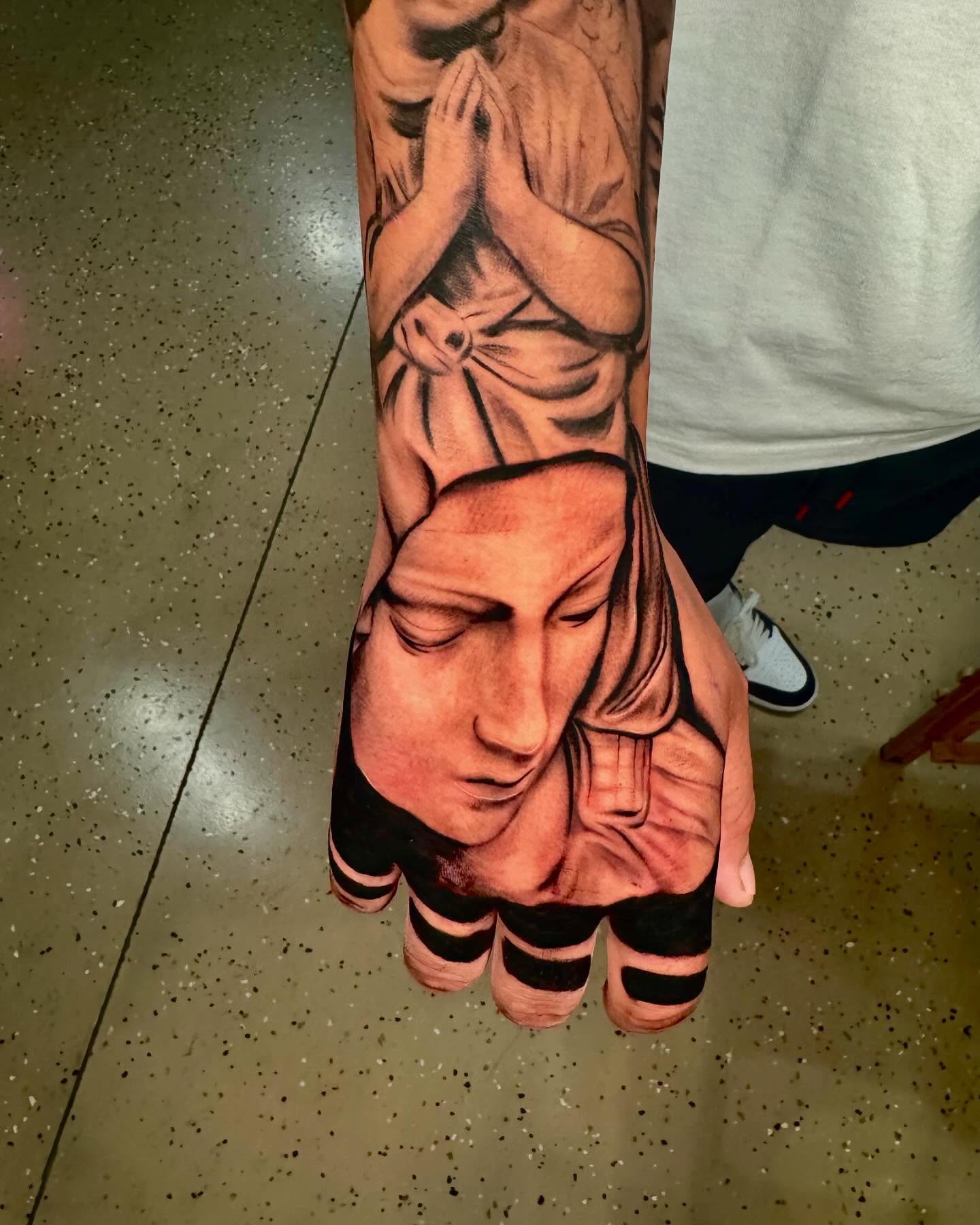 Praying nun realism tattoo on the forearm by Ian Chancellor, Leighton Buzzard, England