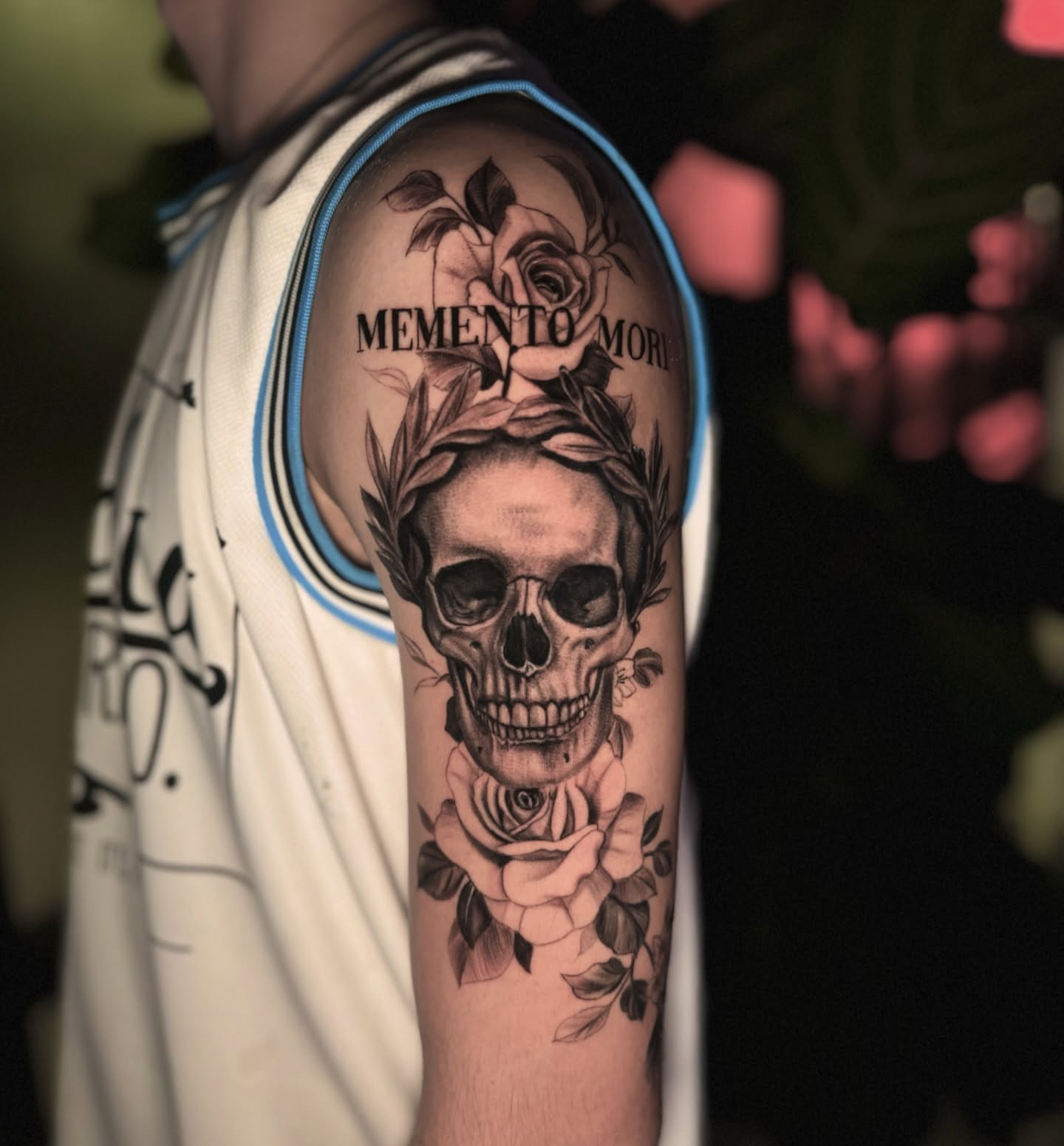 Skull and roses realism tattoo on the forearm by Dallas Tattoo Artist