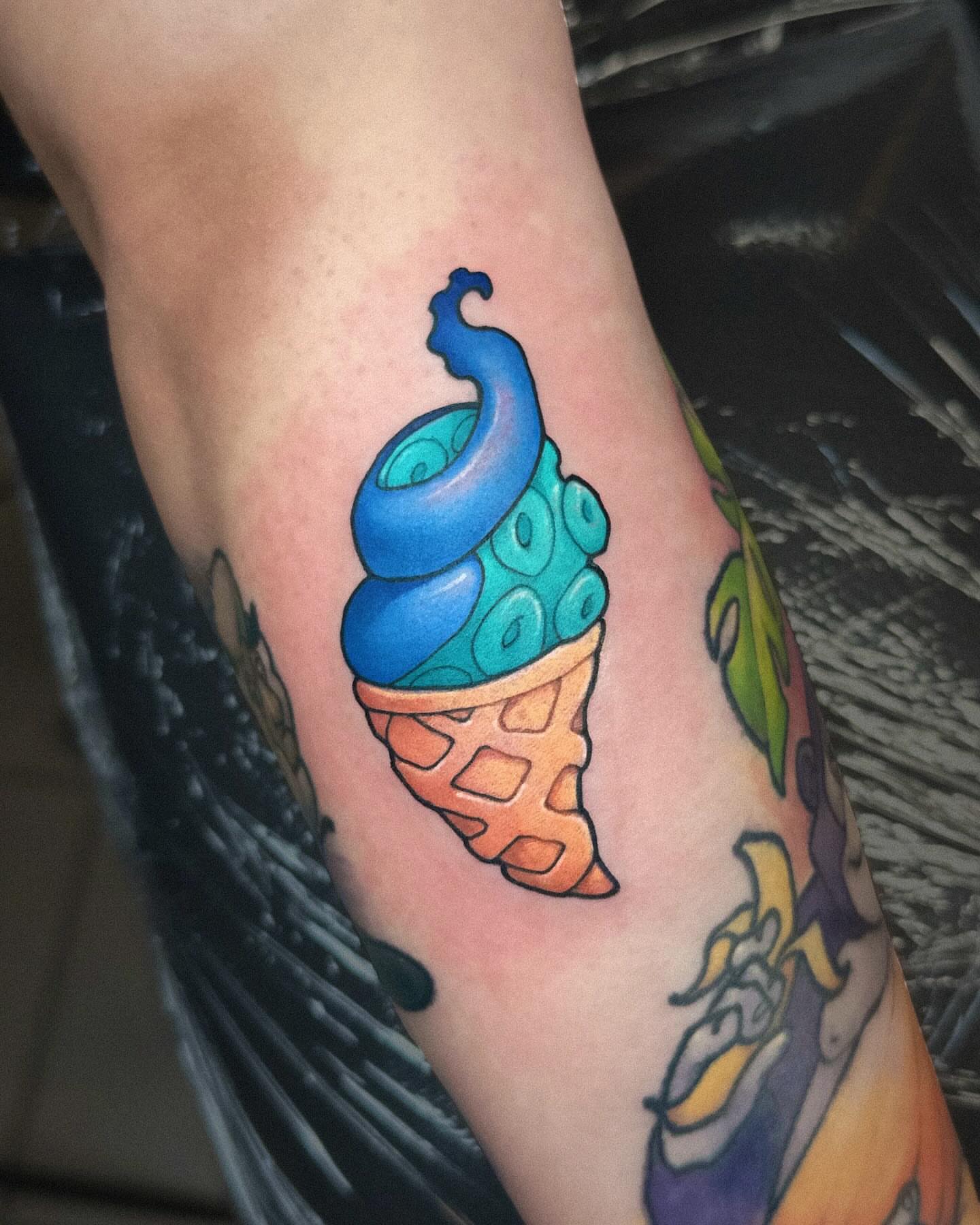 Ice cream cone American traditional tattoo on the forearm by Lena Aleksandrova