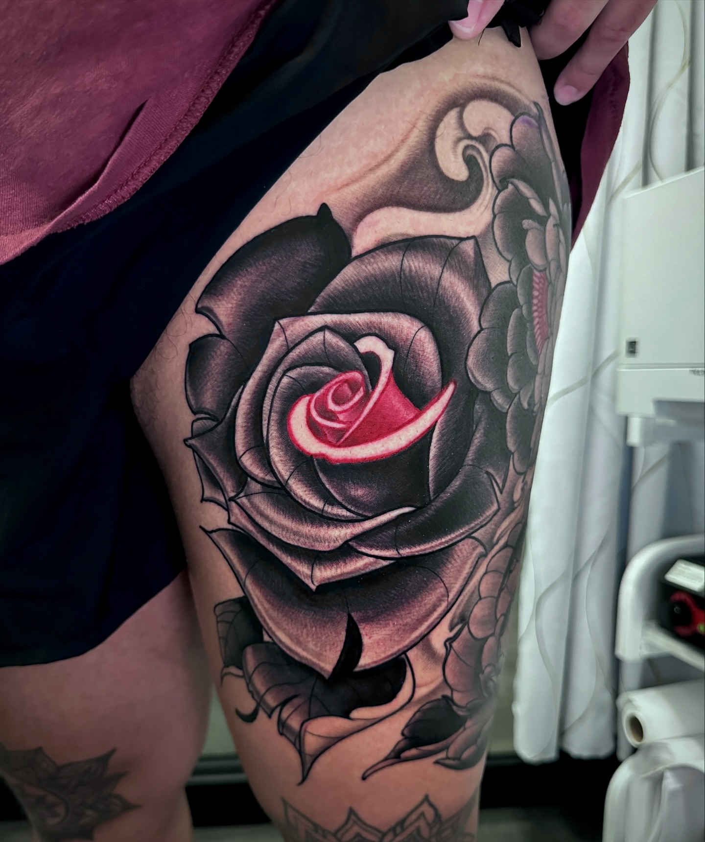 Black rose realism tattoo on the thigh by Ty Pallotta, Austin, Texas