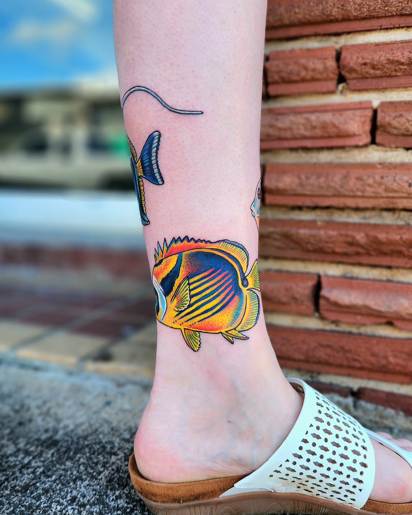 Fish new school tattoo on the foot by Elizabeth Stepp