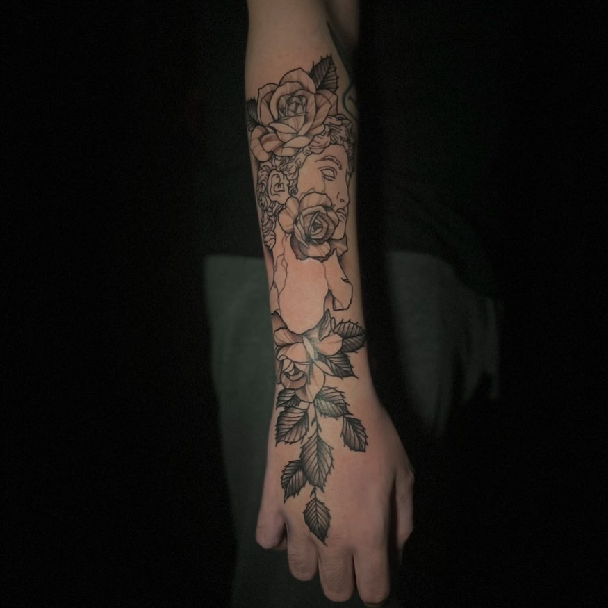 Rose and skull black and grey tattoo on the forearm by Brooke, Kansas City, Missouri
