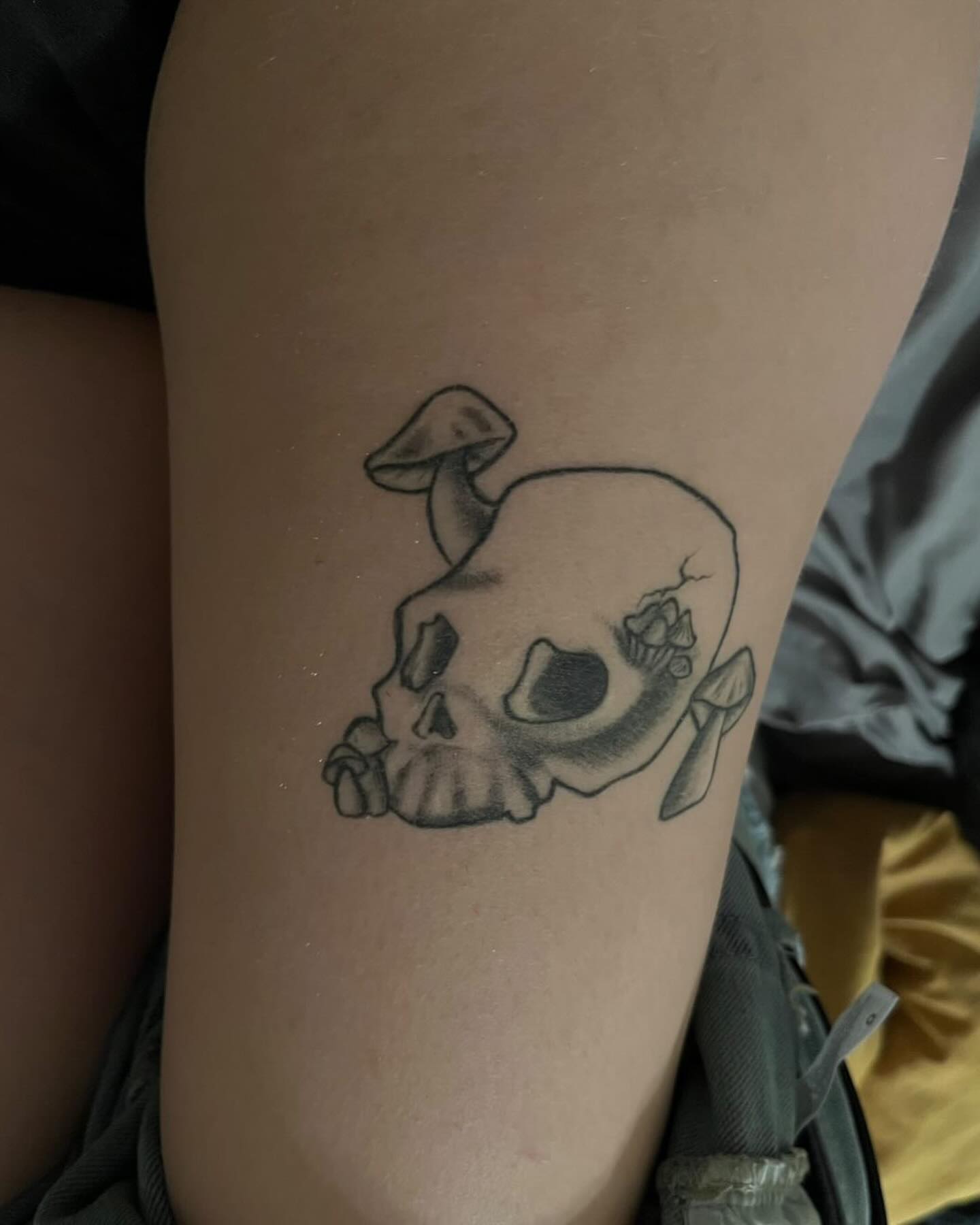 Skull with mushroom black and grey tattoo on the forearm by Alberto M