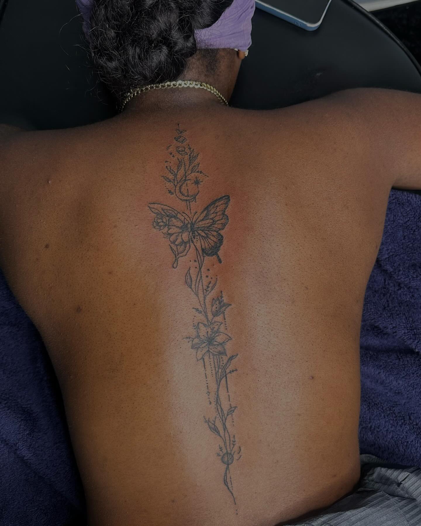 Butterfly and floral black and grey tattoo on the back by Bay Area Tattoo Artist ✍🏽