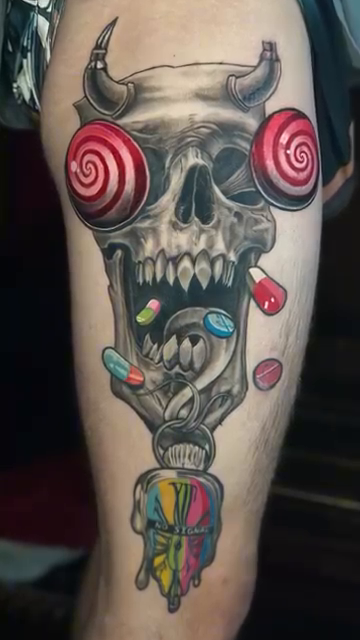 Skull with candy dark realism tattoo by Adrian Dominguez, Las Vegas, Nevada