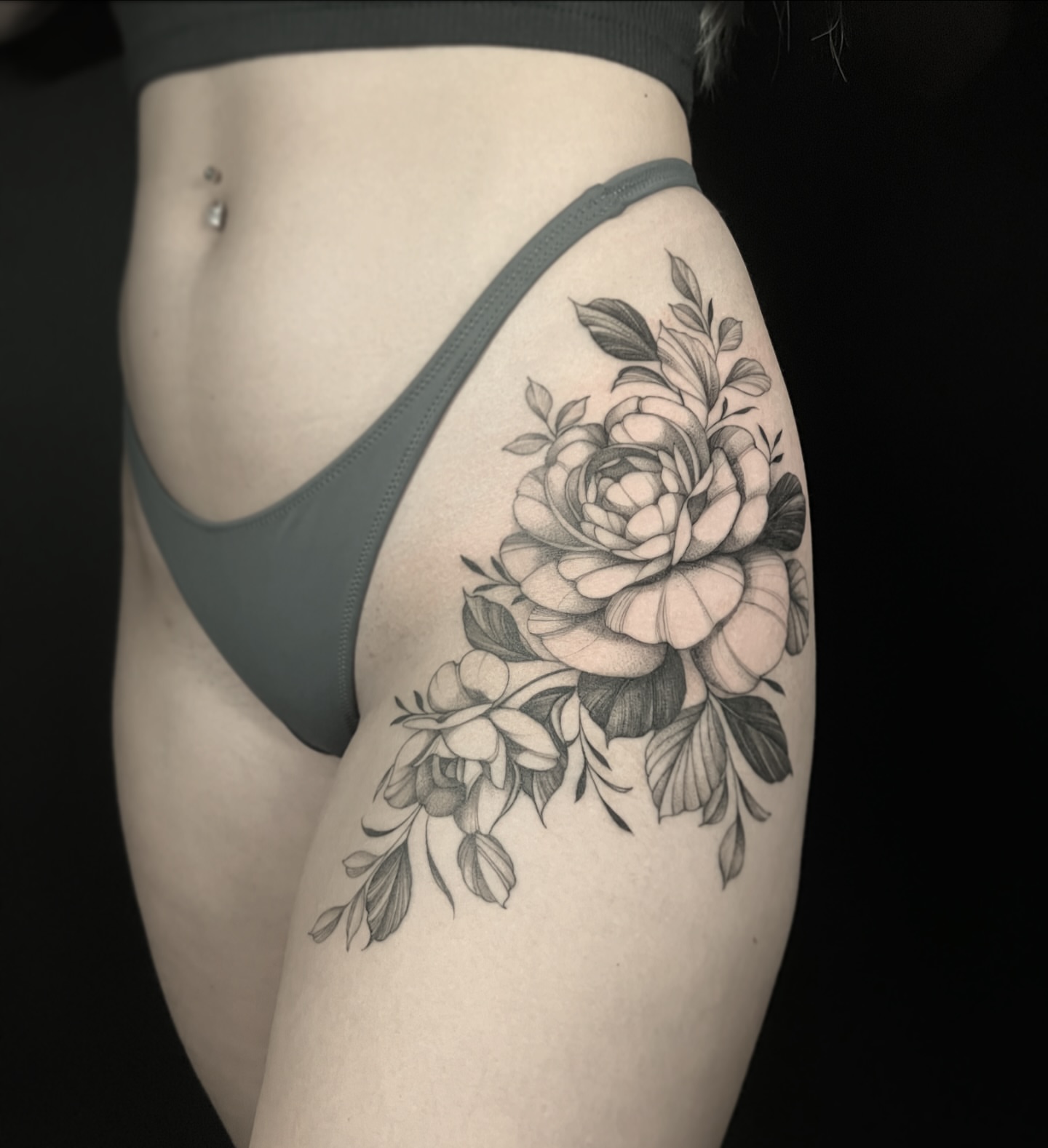 Peony black and grey tattoo on the thigh by Chelsea Speirs