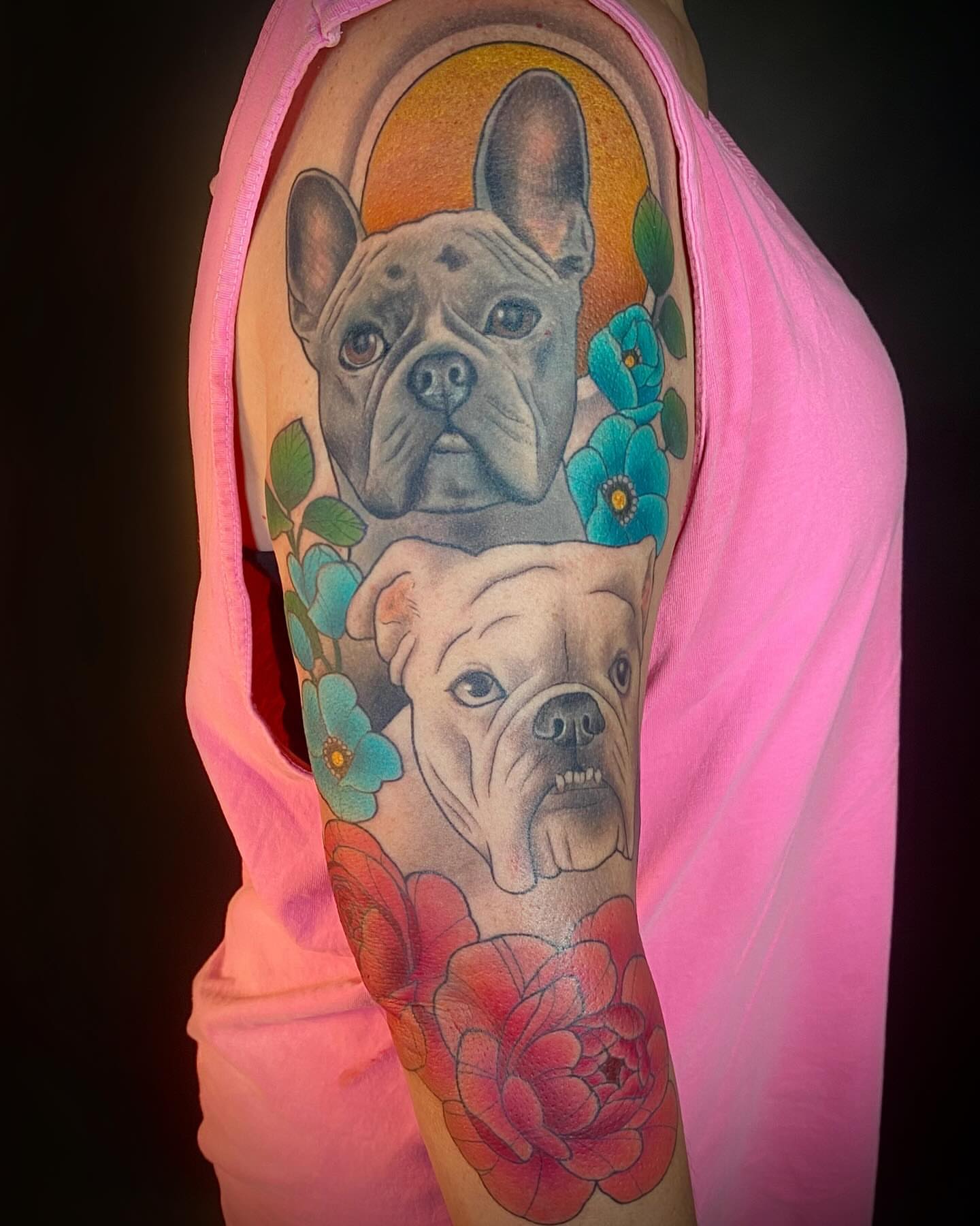 Bulldogs and flowers realism tattoo on the forearm by Barbara Niblo