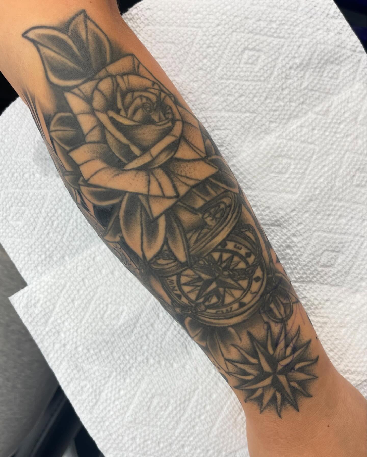Rose and compass realism tattoo on the forearm by Autumn Fulford
