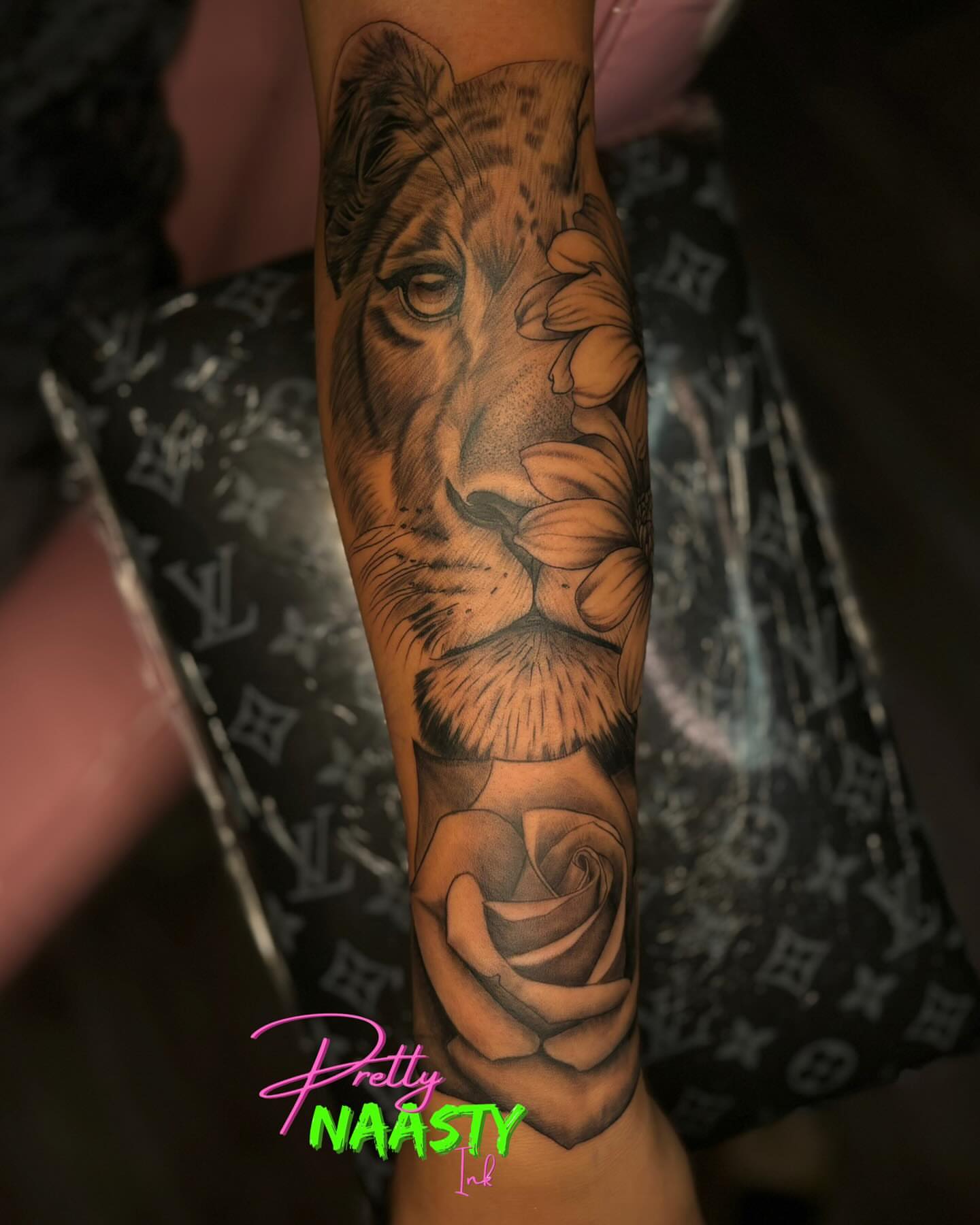 Lion and rose realism tattoo on the forearm by Pretty Naasty Ink🖤