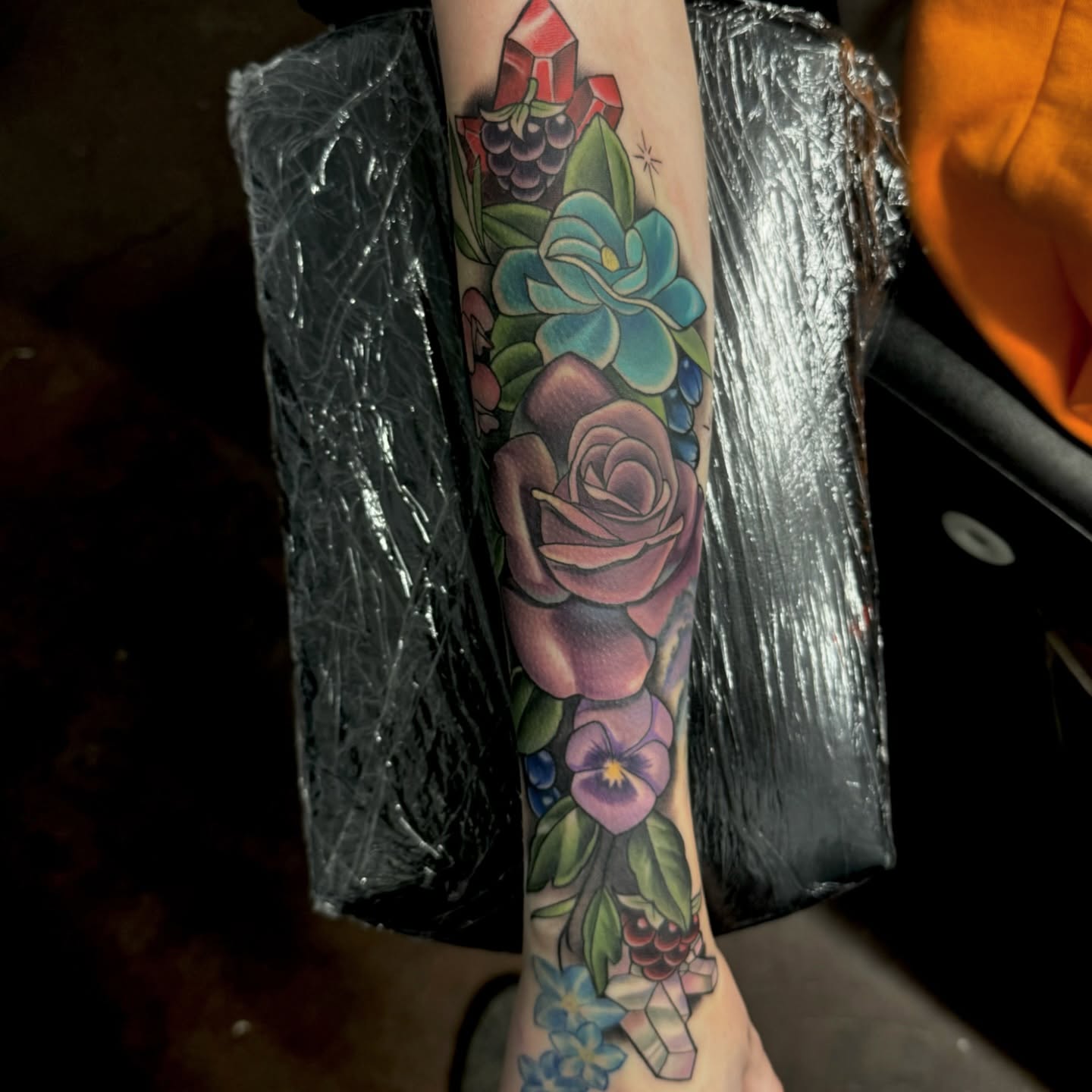 Floral arrangement American traditional tattoo on the forearm by Kyle hodge