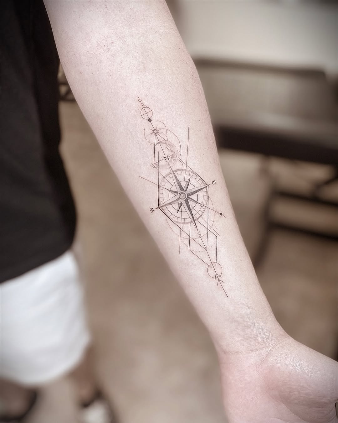 Compass with geometric elements geometric tattoo on the forearm by Chanel Picquelle, Nashville, Tennessee