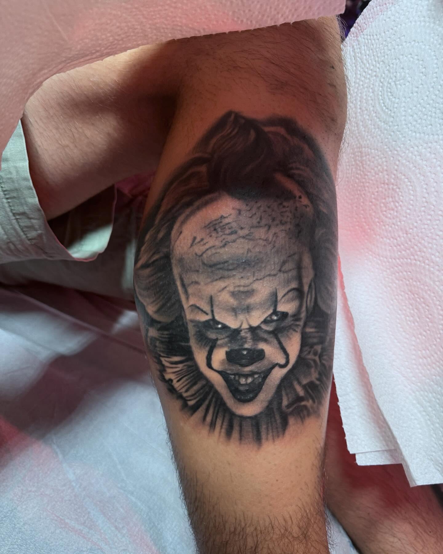 Clown face black and grey tattoo on the forearm by Jen Bean, Richmond, Virginia