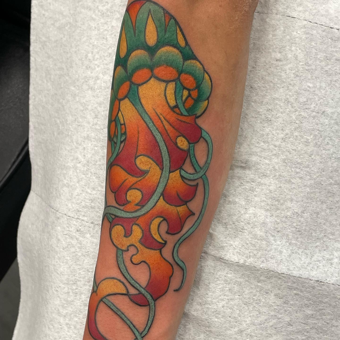 Floral pattern new school tattoo on the forearm by Michael Joy